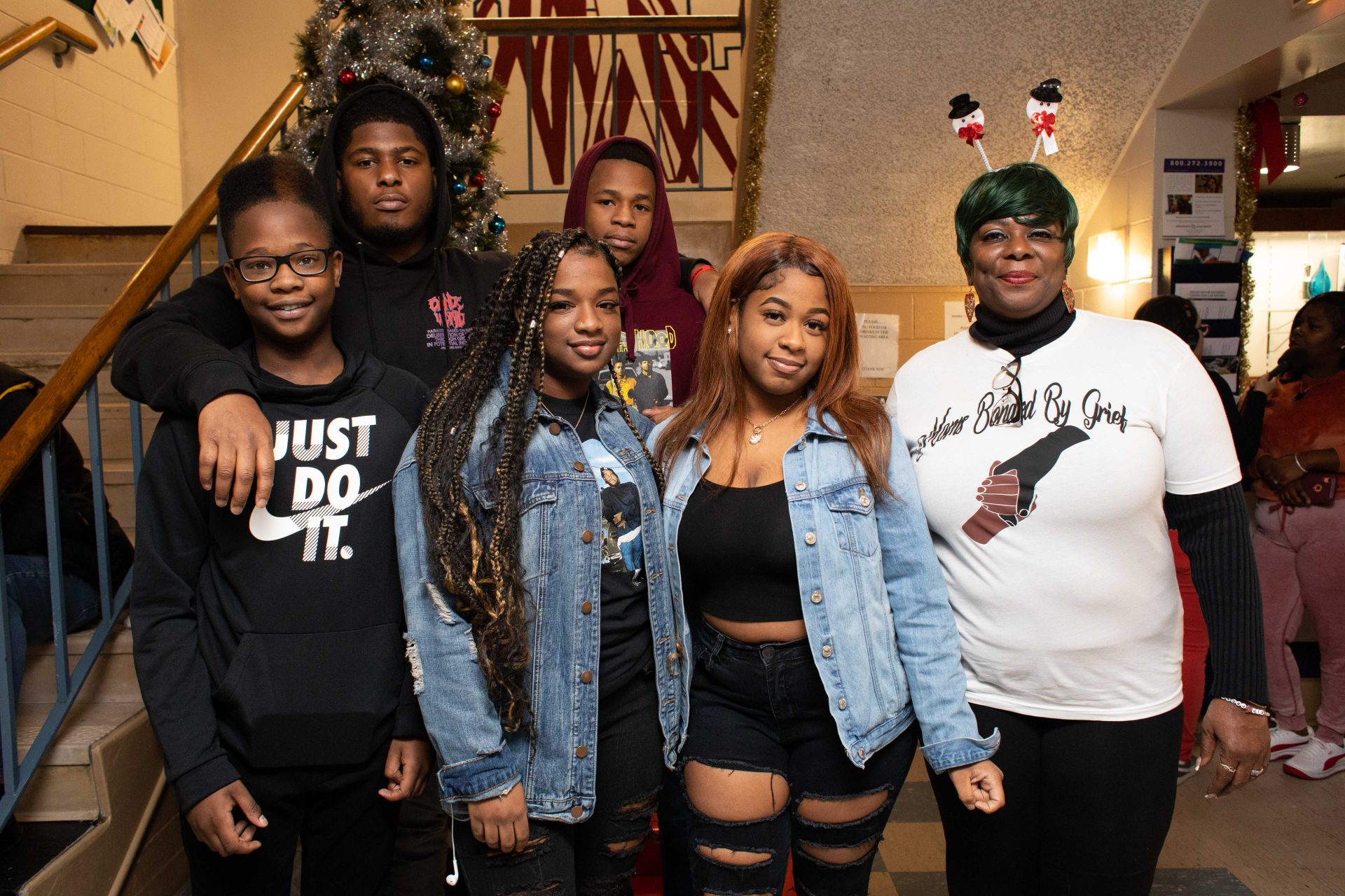 Lisa Harmon (right) attended the Moms Bonded By Grief holiday party in South Philadelphia on Sunday with her grandchildren and son. Lisa's son Alan Gray was killed last year. Pictured is Shahir Hamilton, Shawn Harmon, Aniyah Hamilton-Gray, Amir Hamilton-Gray, Sakiyah Hamilton-Gray and Lisa Harmon.