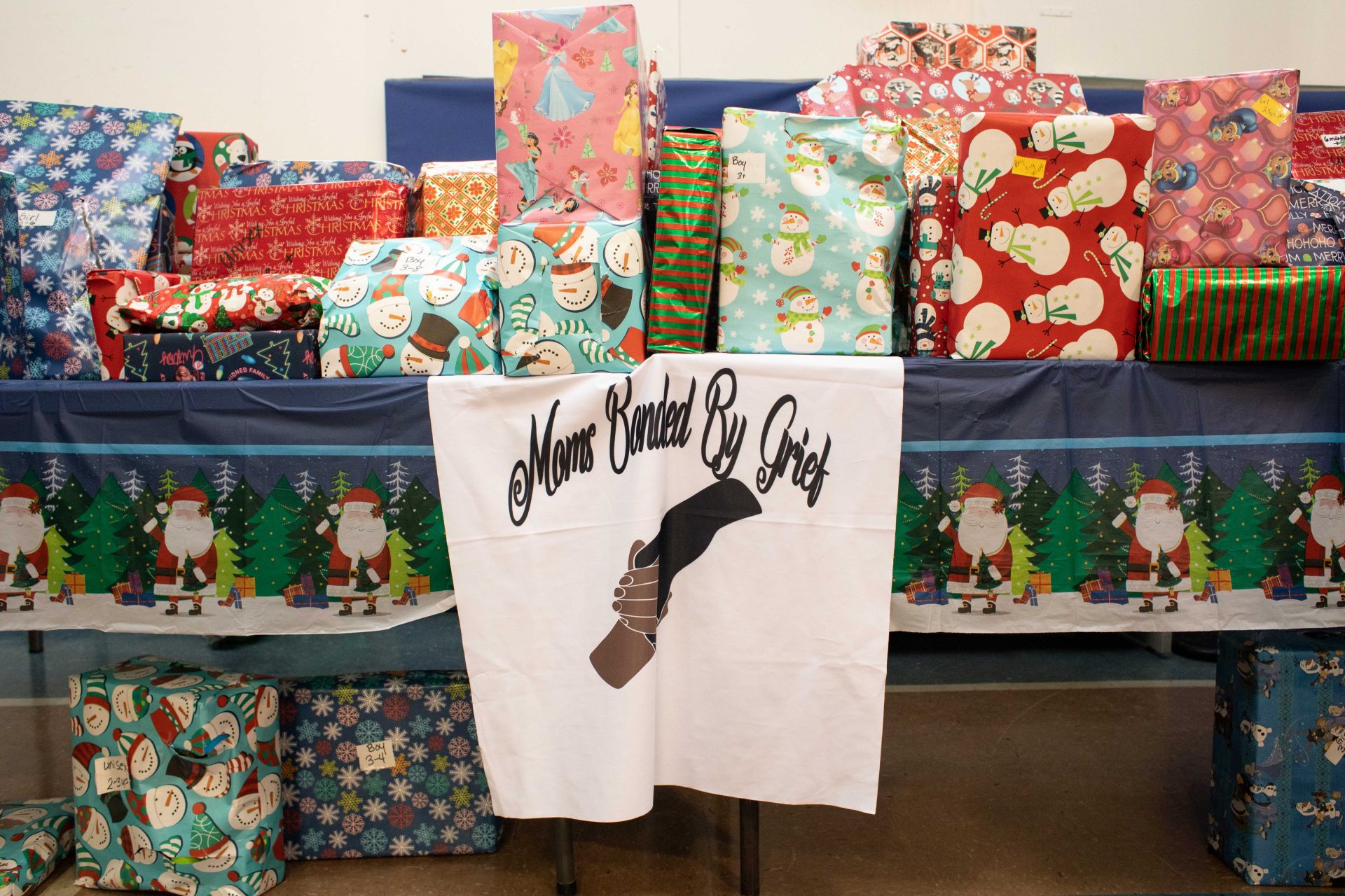 Moms bonded by grief organized Christmas gifts to give to children who have lost a family member to gun violence.