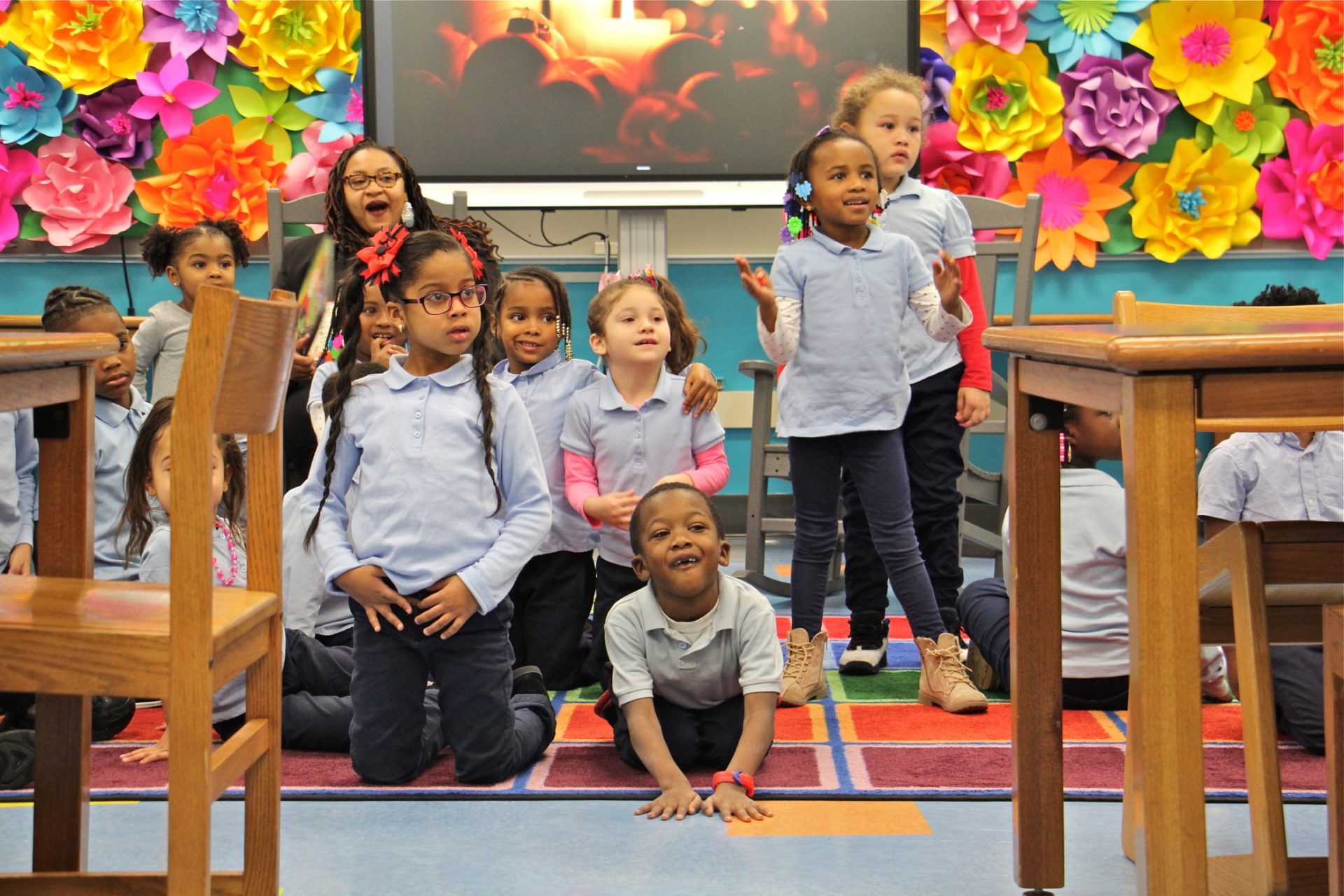 Kindergarten students at Bethune Elementary school react to the arrival of Philadelphia 76ers star Tobias Harris.