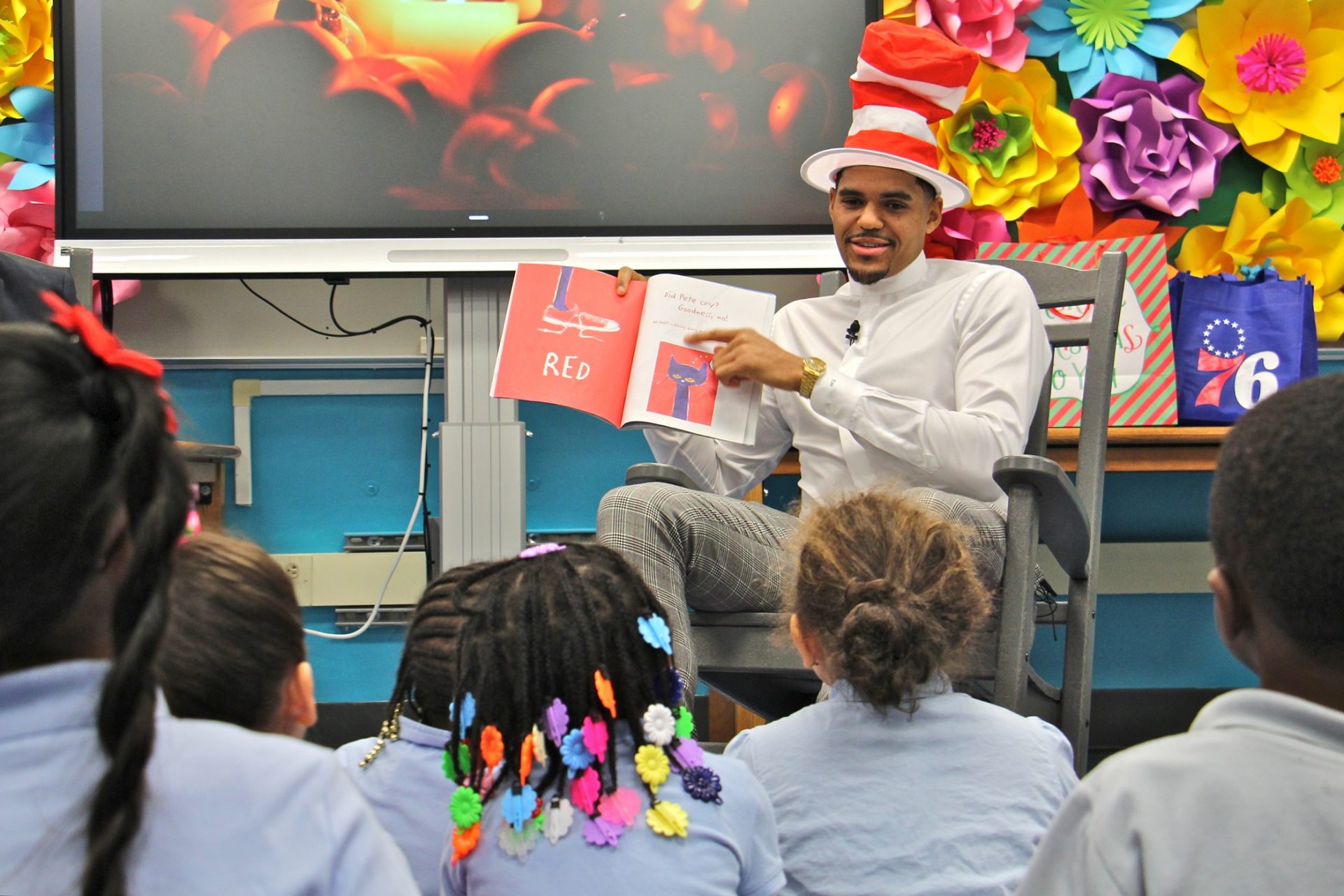 Sixers star Tobias Harris reads 'Pete the Cat' to a group of kindergarten students at Bethune Elementary School.