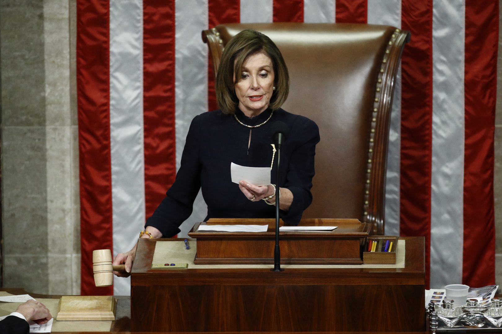 House Speaker Nancy Pelosi of Calif., readies to strike the gavel as she announces the passage of article II of impeachment against President Donald Trump, Wednesday, Dec. 18, 2019, on Capitol Hill in Washington.
