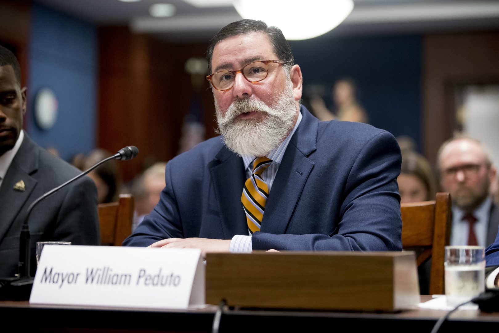 Pittsburgh Mayor Bill Peduto speaks at a Senate Democrats' Special Committee on the Climate Crisis on Capitol Hill in Washington, Wednesday, July 17, 2019. Former New York City mayor Michael Bloomberg is courting Peduto's endorsement in the Democratic presidential primary. (AP Photo/Andrew Harnik)