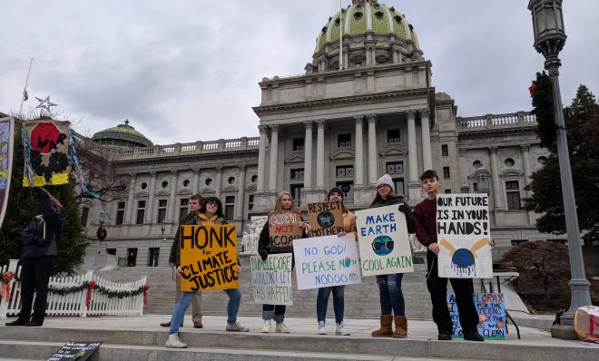 Students from Susquehanna Township and Cedar Cliff high schools demonstrate for action on climate change in front of the state capitol on Friday, December 6, 2019. 
