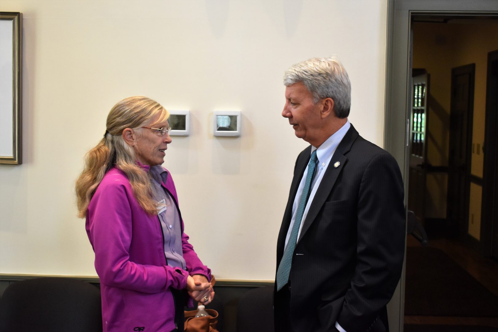 Starr Cummin Bright, a gunshot survivor, speaks with state Sen. Tom Killion, R-Delaware/Chester, ahead of a panel discussion on Oct. 1, 2019, at the Chadds Ford Township Municipal Building.