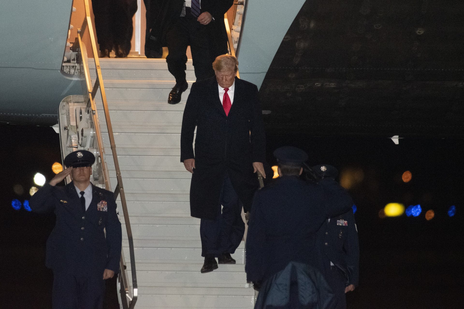 President Donald Trump exits Air Force One, Saturday, Dec. 14, 2019, at Andrews Air Force Base, Md., following a trip to Philadelphia to attend the Army-Navy football game.