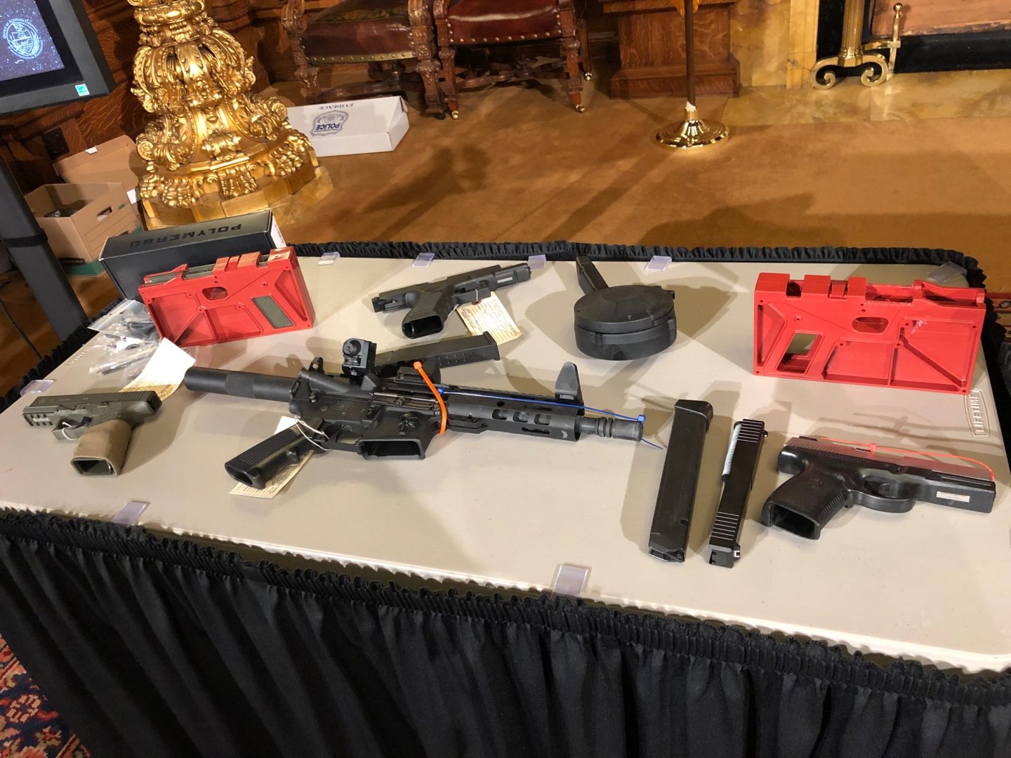 Guns, including ones made through DIY kits, are displayed on a table in the Governor's Reception Room of the state Capitol on Dec. 16, 2019.