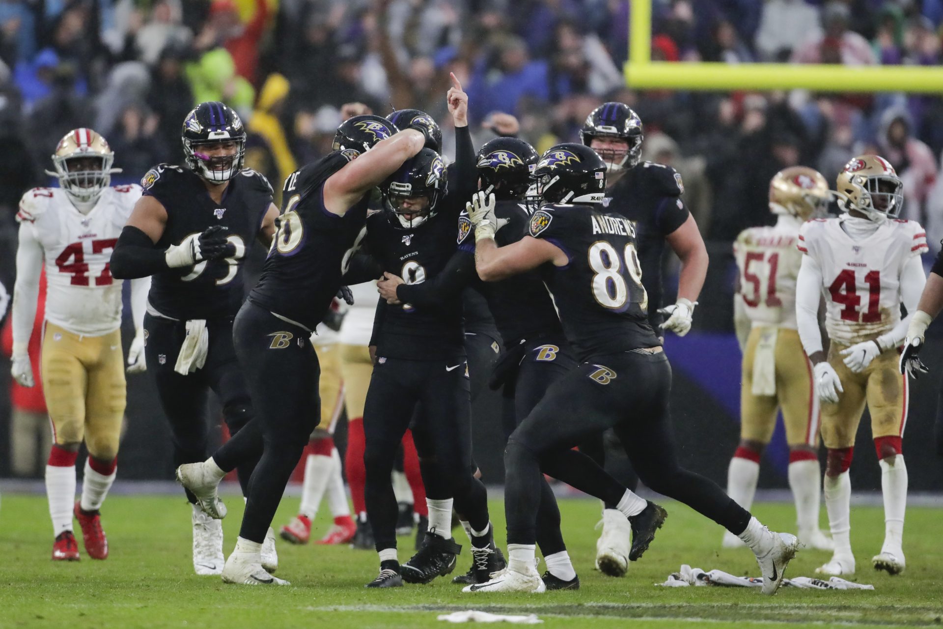 Baltimore Ravens kicker Justin Tucker (9) is surrounded by teammates after kicking the winning field goal against the San Francisco 49ers in the second half of an NFL football game, Sunday, Dec. 1, 2019, in Baltimore, Md. Ravens won 20-17.