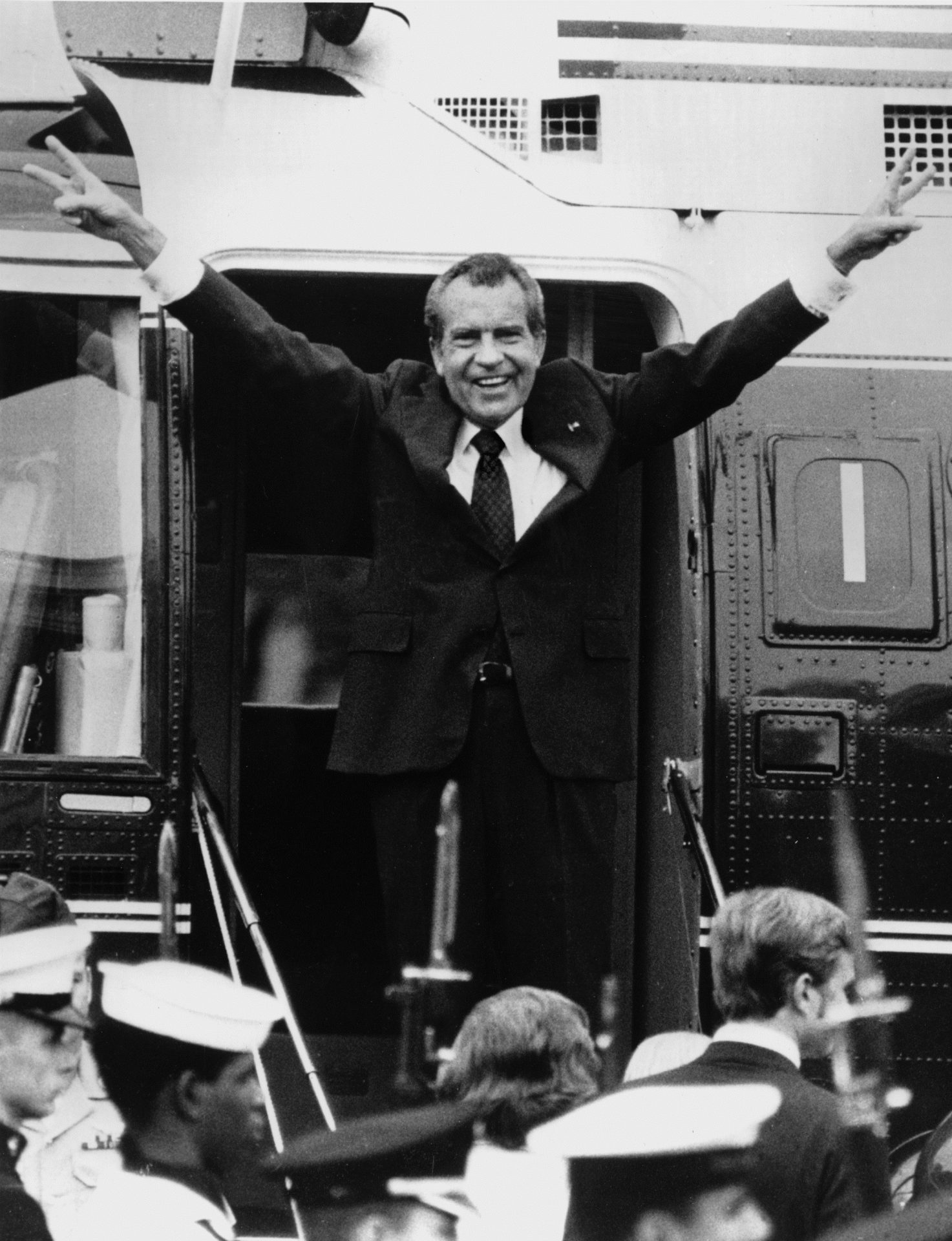 FILE PHOTO: Richard Nixon says goodbye with a victorious salute to his staff members outside the White House as he boards a helicopter after resigning the presidency on Aug. 9, 1974. Nixon was the first president in American history to resign the nation's highest office. His resignation came after approval of an impeachment article against him by the House Judiciary Committee for withholding evidence from Congress. He stepped down as the 37th president with a 2,026-day term, urging Americans to rally behind Gerald R. Ford. President Ford fully pardoned Nixon one month later.