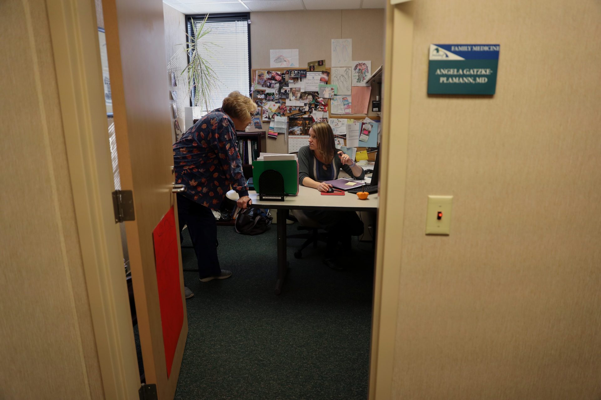 Dr. Gatzke-Plamann in her office at the Necedah Family Medical Center with medical assistant Laurie Kenke. She says it's challenging to make room for a buprenorphine practice as well as a family practice, but she considers it an important responsibility for her community. "There isn't another me just down the road. I'm the only one here. So if I can fulfill that need, then I should do that."