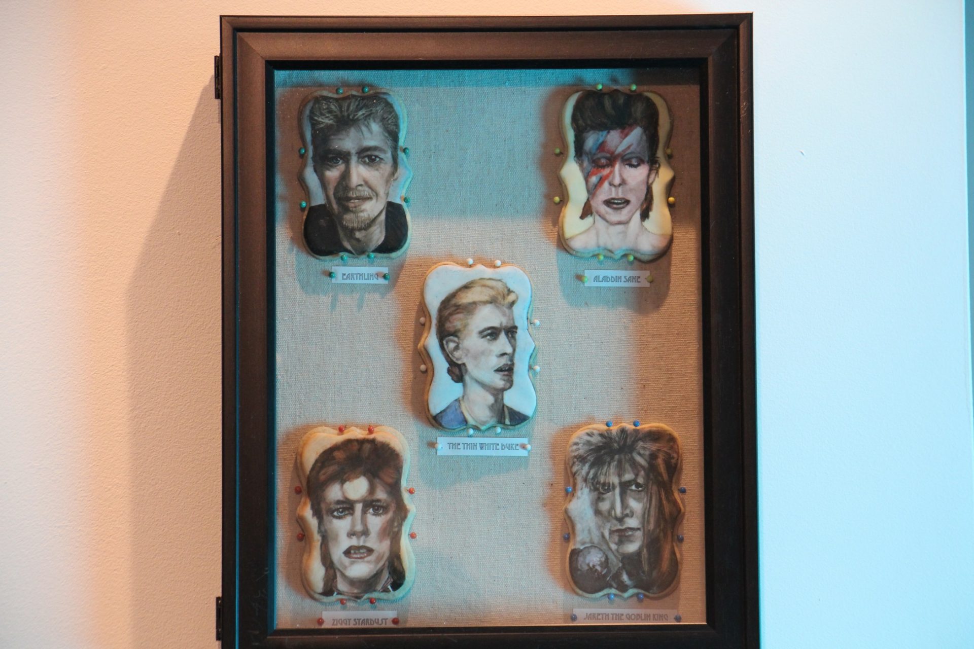 Five hand-painted sugar cookies made Jennifer Roach and titled 'Edible Rebel,' pay tribute to David Bowie's characters.