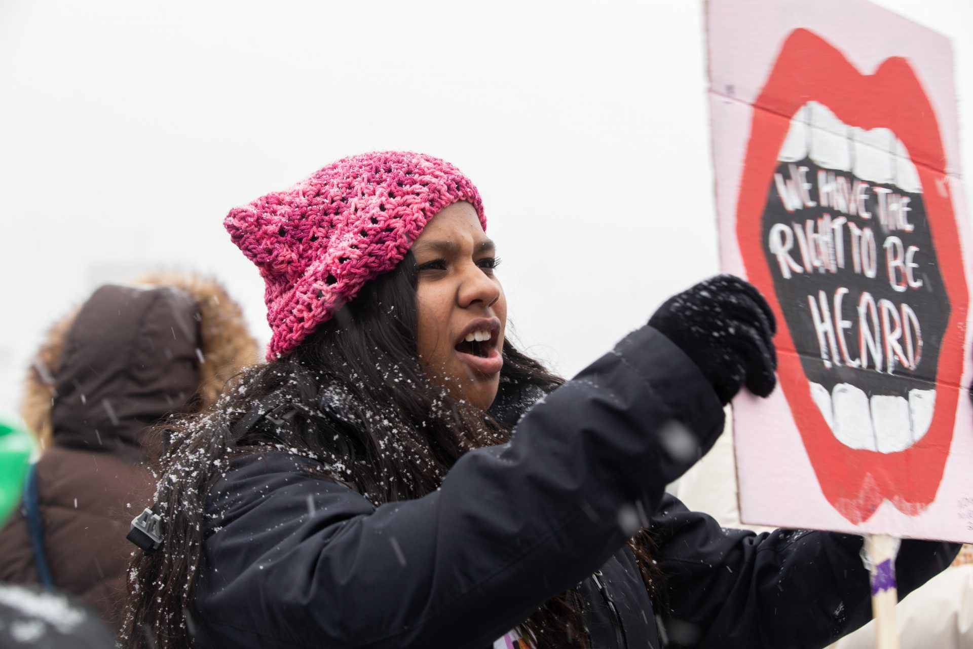 Gabbi Chacko, a student at Downingtown East High School, shows her support at the Women's March on Philadelphia with a homemade sign.