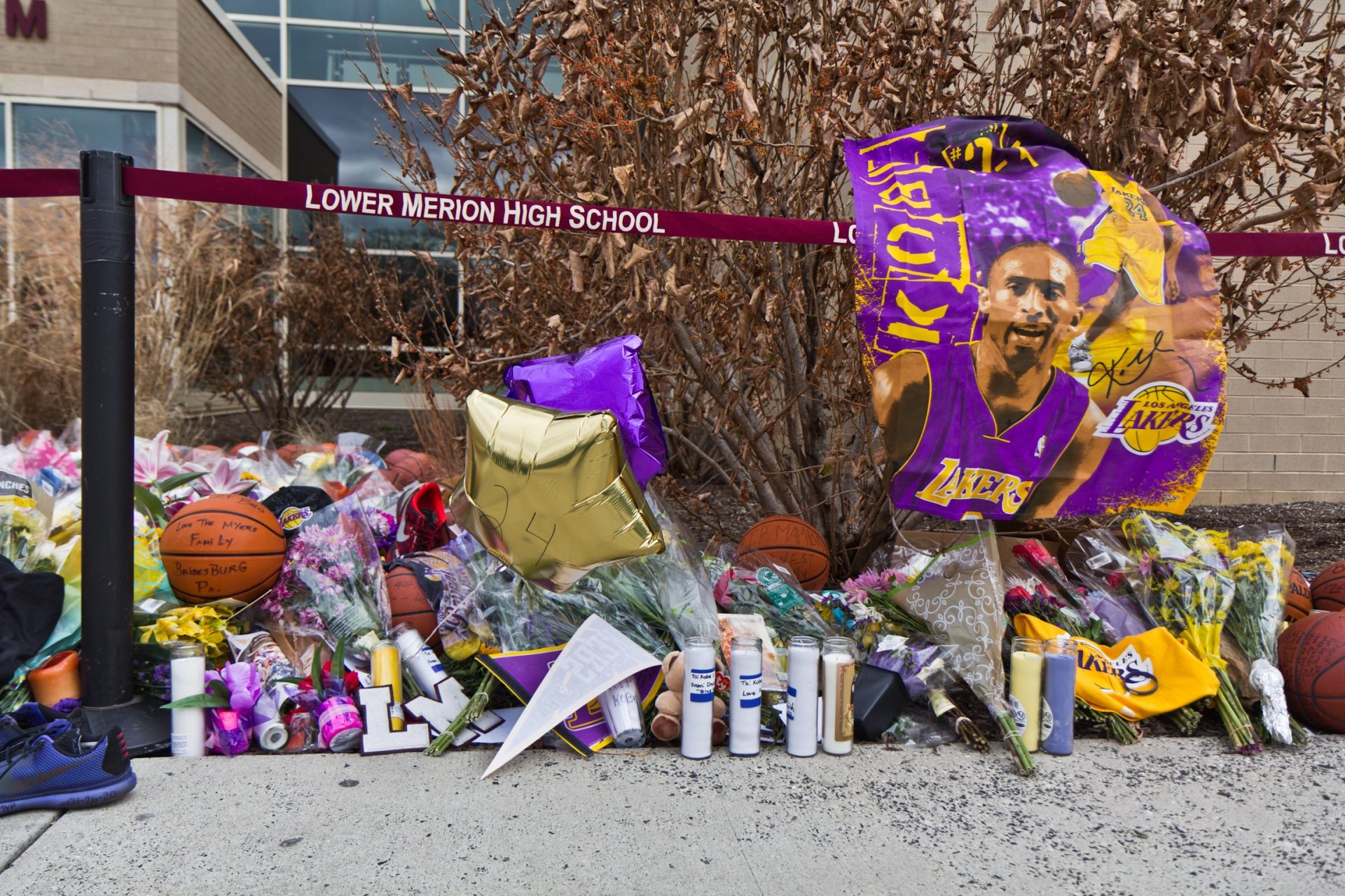 A memorial for late basketball superstar Kobe Bryant grows outside the Lower Merion high school gymnasium named for him.