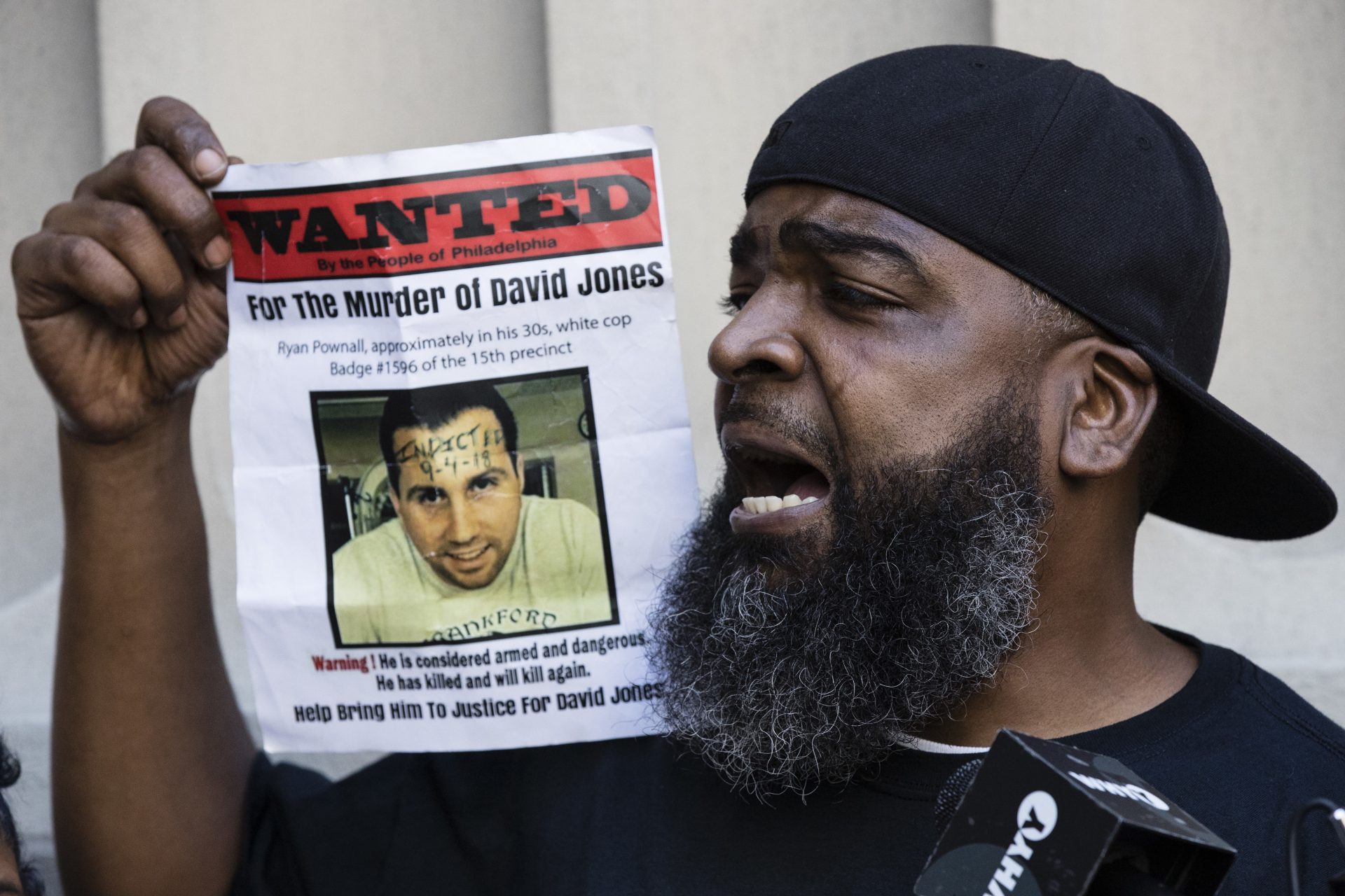 Isaac Gardner, with the Justice for David Jones Coalition, speaks with members of the media in Philadelphia, Tuesday, Sept. 4, 2018. Philadelphia District Attorney Larry Krasner said Ryan Pownall, a fired white Philadelphia police officer, has been charged with criminal homicide for fatally shooting of David Jones in the back after a confrontation over a dirt bike.