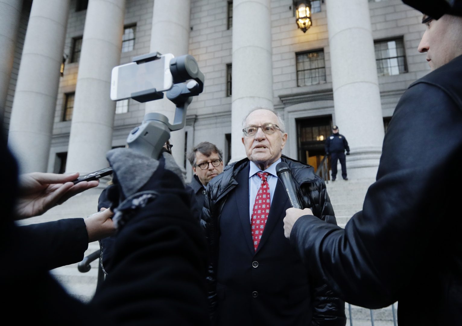 FILE PHOTO: Attorney Alan Dershowitz speaks during a news interview outside of Manhattan Federal Court Wednesday, March 6, 2019, in New York.