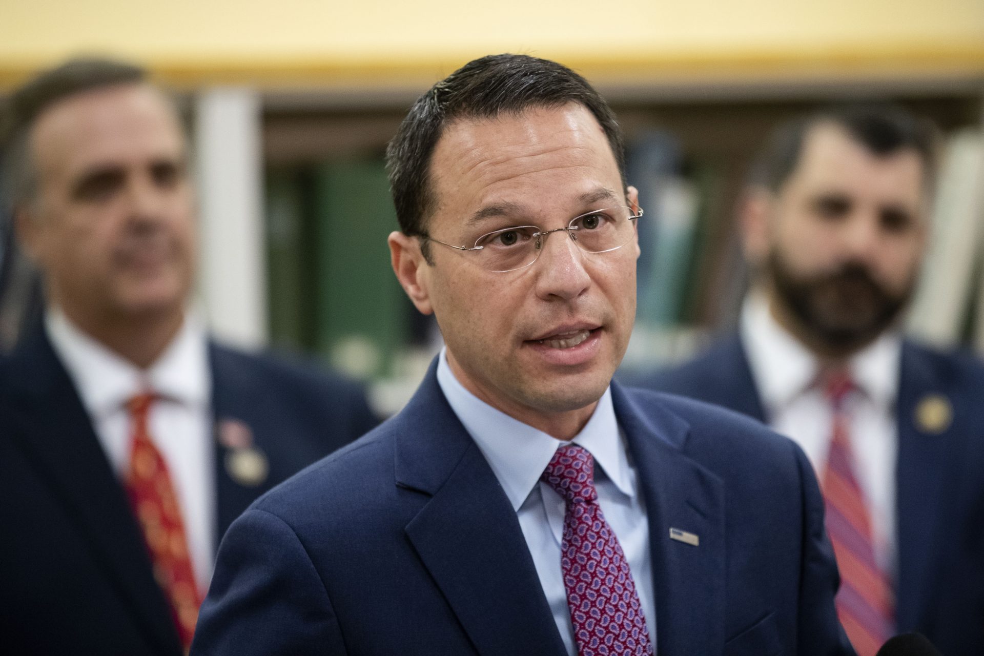 Pennsylvania Attorney General Josh Shapiro, center, accompanied by Rep. Jim Gregory, R-Blair, left, and Rep. Mark Rozzi, D-Berks, speaks at Muhlenberg High School in Reading, Pa., Tuesday, Nov. 26, 2019.