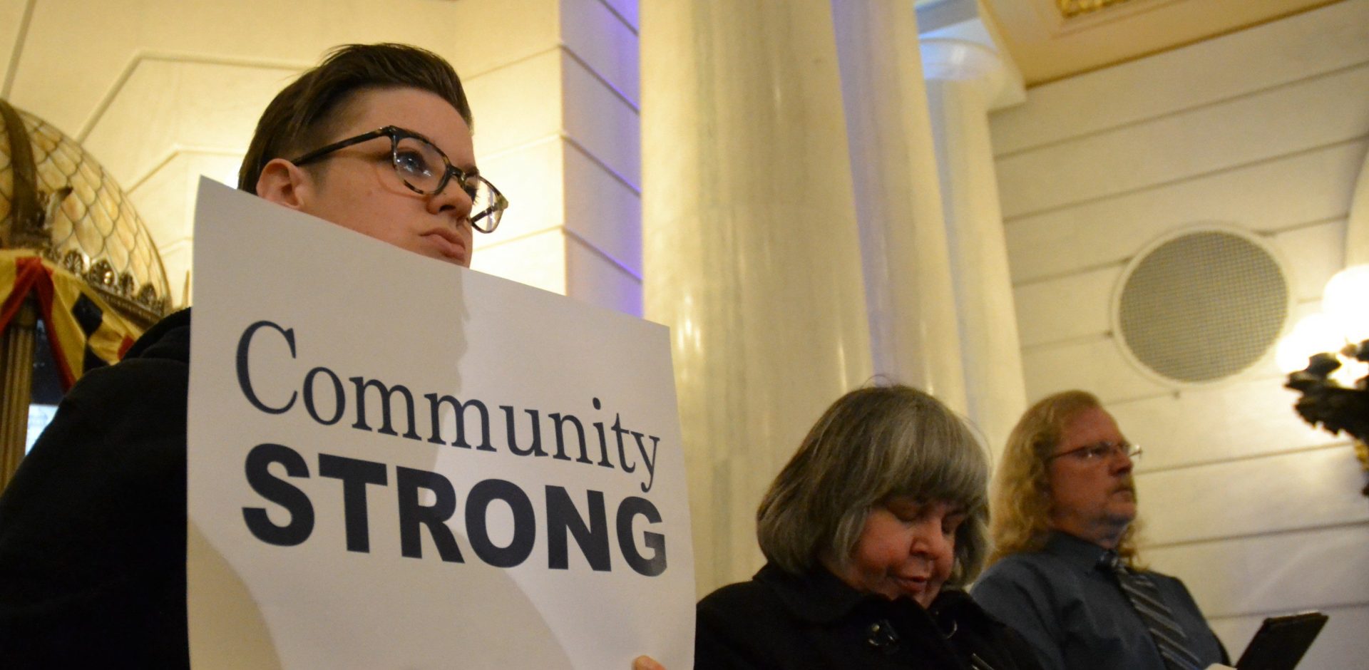 At left, Laura Alden of  Philadelphia-based Liberty Resources holds a sign opposing SB 906. during a rally at the state Capitol Tues., Jan. 7. 