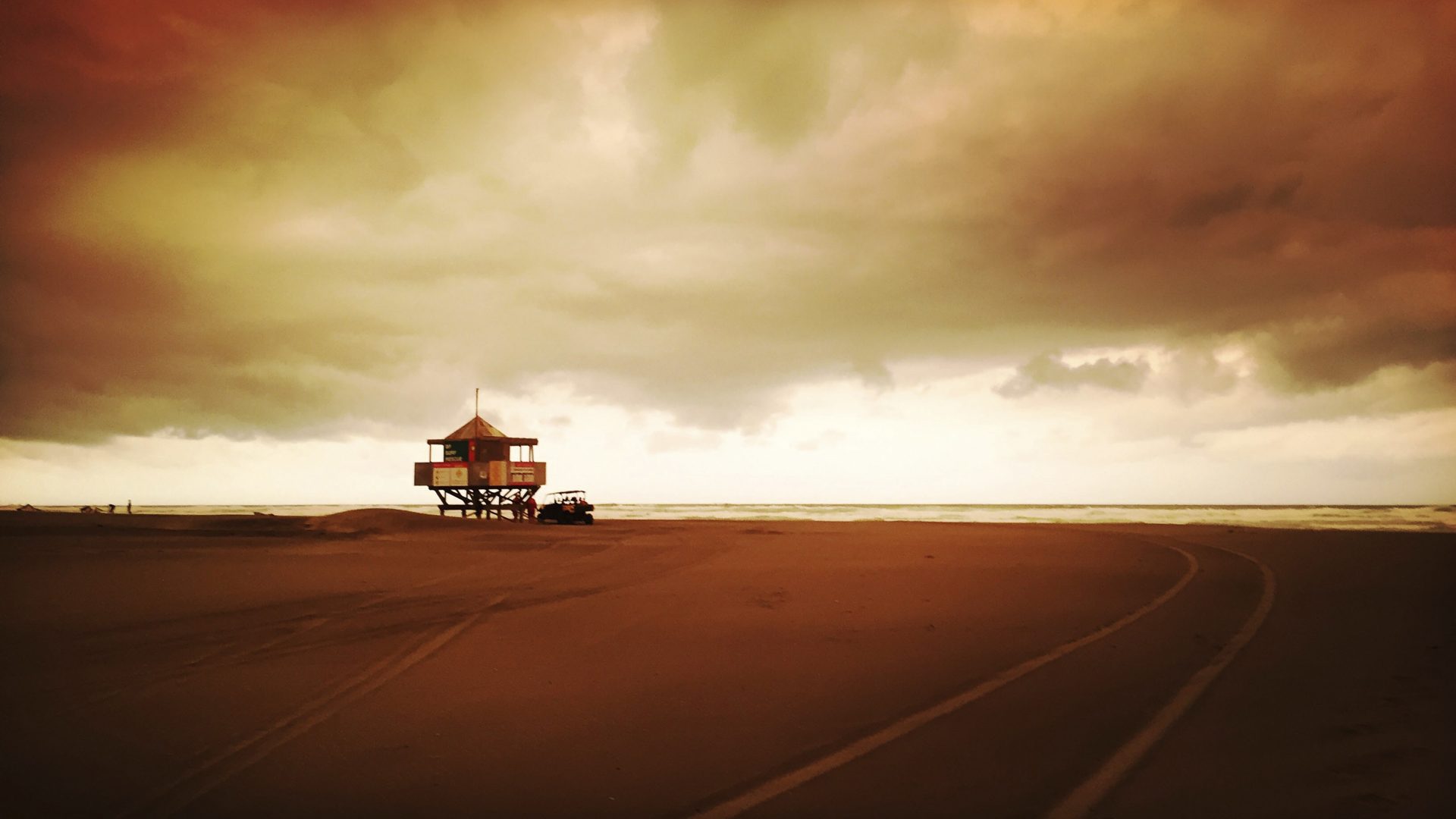 The sky above Bethells Beach on the west coast near Auckland turns orange as smoke from the Australia wildfires arrives in New Zealand, Sunday, Jan. 5, 2020. Australian Prime Minister Scott Morrison defended his leadership and his government's record on climate change Sunday as milder temperatures brought hope of a respite from wildfires that have ravaged three states, destroying almost 2,000 homes.