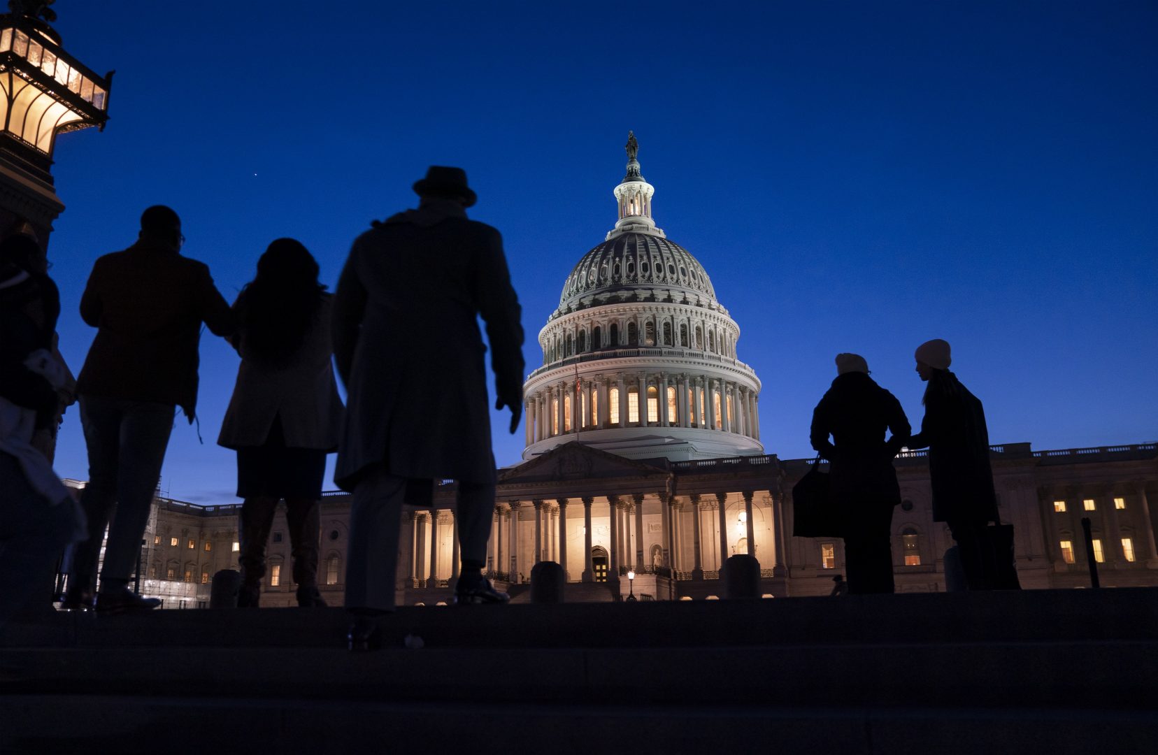 Night falls on the Capitol, in Washington, Wednesday evening, Jan. 22, 2020, during in the impeachment trial of President Donald Trump. House prosecutors are outlining what they refer to as President Donald Trump's “corrupt scheme” to abuse power and obstruct Congress as they open six days of arguments in his impeachment trial. 