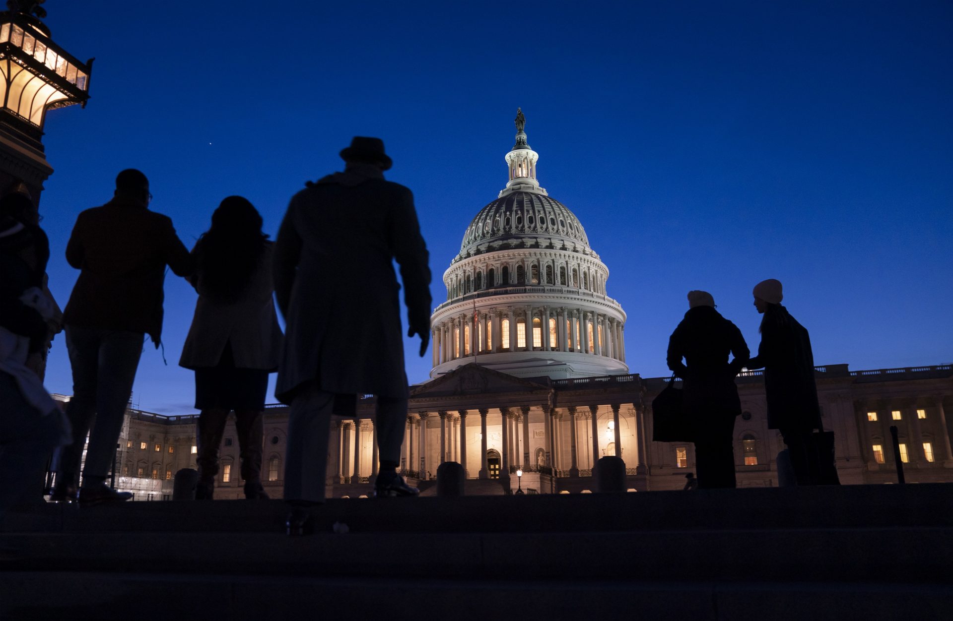 Night falls on the Capitol, in Washington, Wednesday evening, Jan. 22, 2020, during in the impeachment trial of President Donald Trump. House prosecutors are outlining what they refer to as President Donald Trump's “corrupt scheme” to abuse power and obstruct Congress as they open six days of arguments in his impeachment trial.