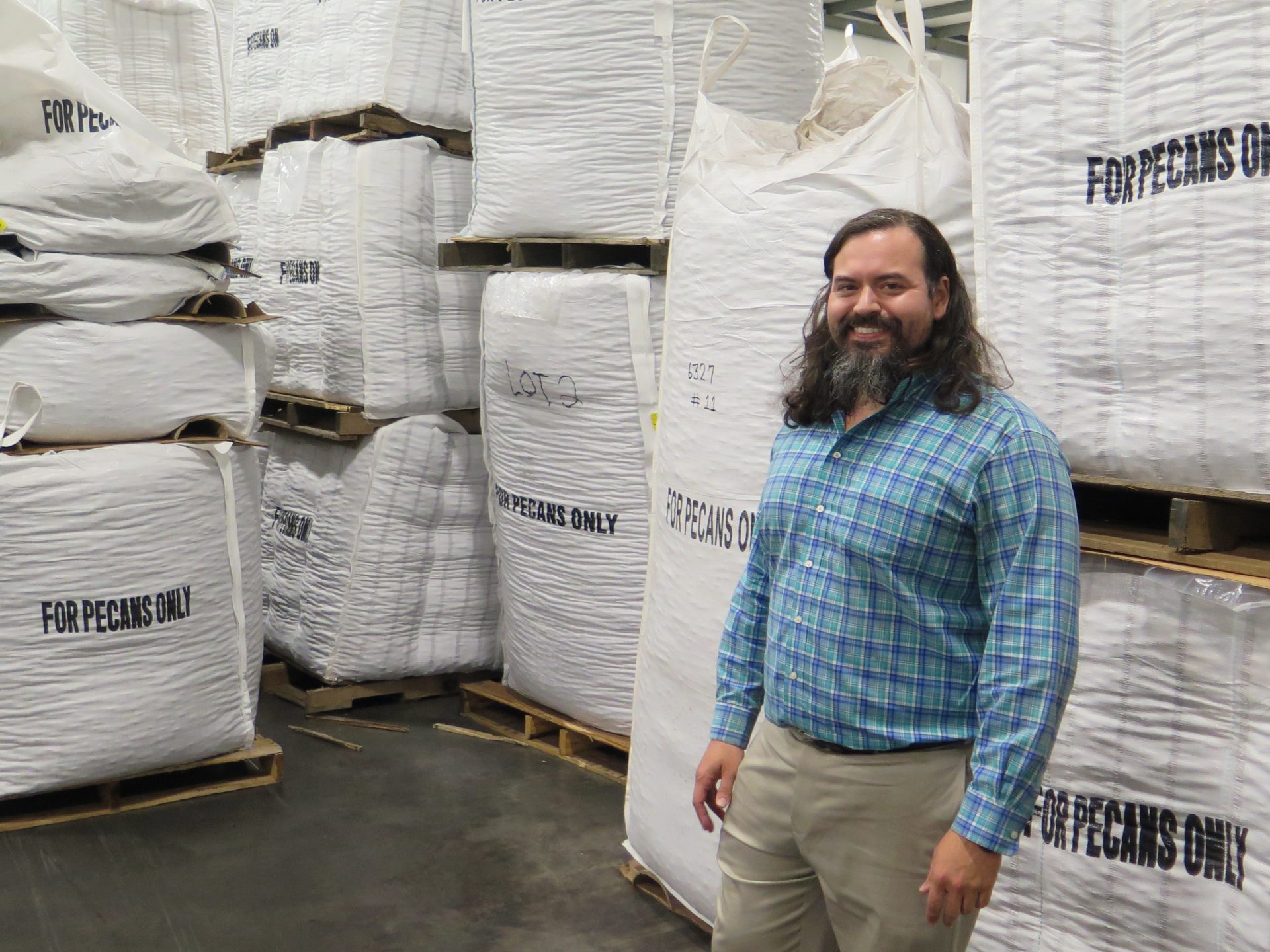 Christopher Worsham stands in his warehouse filled with Georgia pecans. Because of the droughts and the lawsuits, Georgia had to take a hard look at the water it uses for farming. It has placed a moratorium on new wells for agriculture and is requiring all farmers to move to more efficient irrigation systems.
