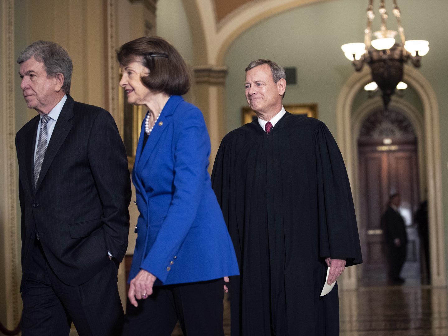 Sen. Roy Blunt, R-Mo. (left); Sen. Dianne Feinstein, D-Calif.; and Supreme Court Chief Justice John Roberts arrive to the Senate chamber for impeachment proceedings on Thursday.
