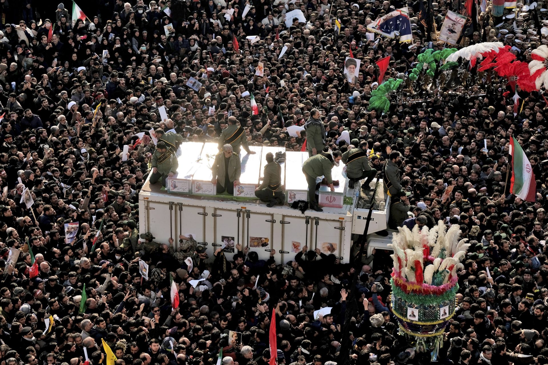 Coffins of Gen. Qassem Soleimani and others who were killed in Iraq by a U.S. drone strike, are carried on a truck surrounded by mourners during a funeral procession, at the Enqelab-e-Eslami (Islamic Revolution) square in Tehran, Iran, Monday, Jan. 6, 2020. The processions mark the first time Iran honored a single man with a multi-city ceremony. Not even Ayatollah Ruhollah Khomeini, who founded the Islamic Republic, received such a processional with his death in 1989. Soleimani on Monday will lie in state at Tehran's famed Musalla mosque as the revolutionary leader did before him.
