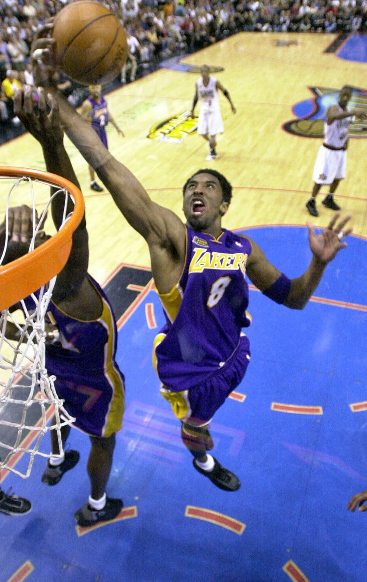 Los Angeles Lakers' Kobe Bryant goes up for a rebound in the fourth quarter against the Philadelphia 76ers' in game 5 of the NBA finals Friday June 15, 2001 in Philadelphia. The Lakers won their second straight NBA championship, defeating the 76ers 108-96 to clinch the best-of-seven series 4-1.