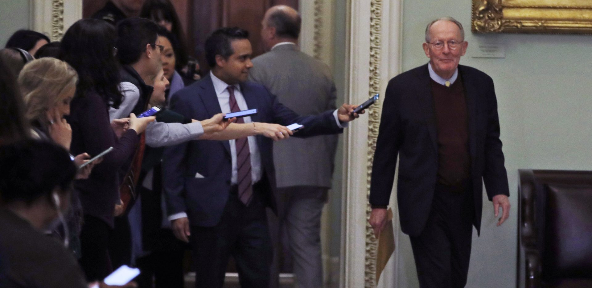 Sen. Lamar Alexander, R-Tenn., walks out of the Senate chambers during a break in the impeachment trial of President Donald Trump at the U.S. Capitol Thursday Jan 30, 2020, in Washington.