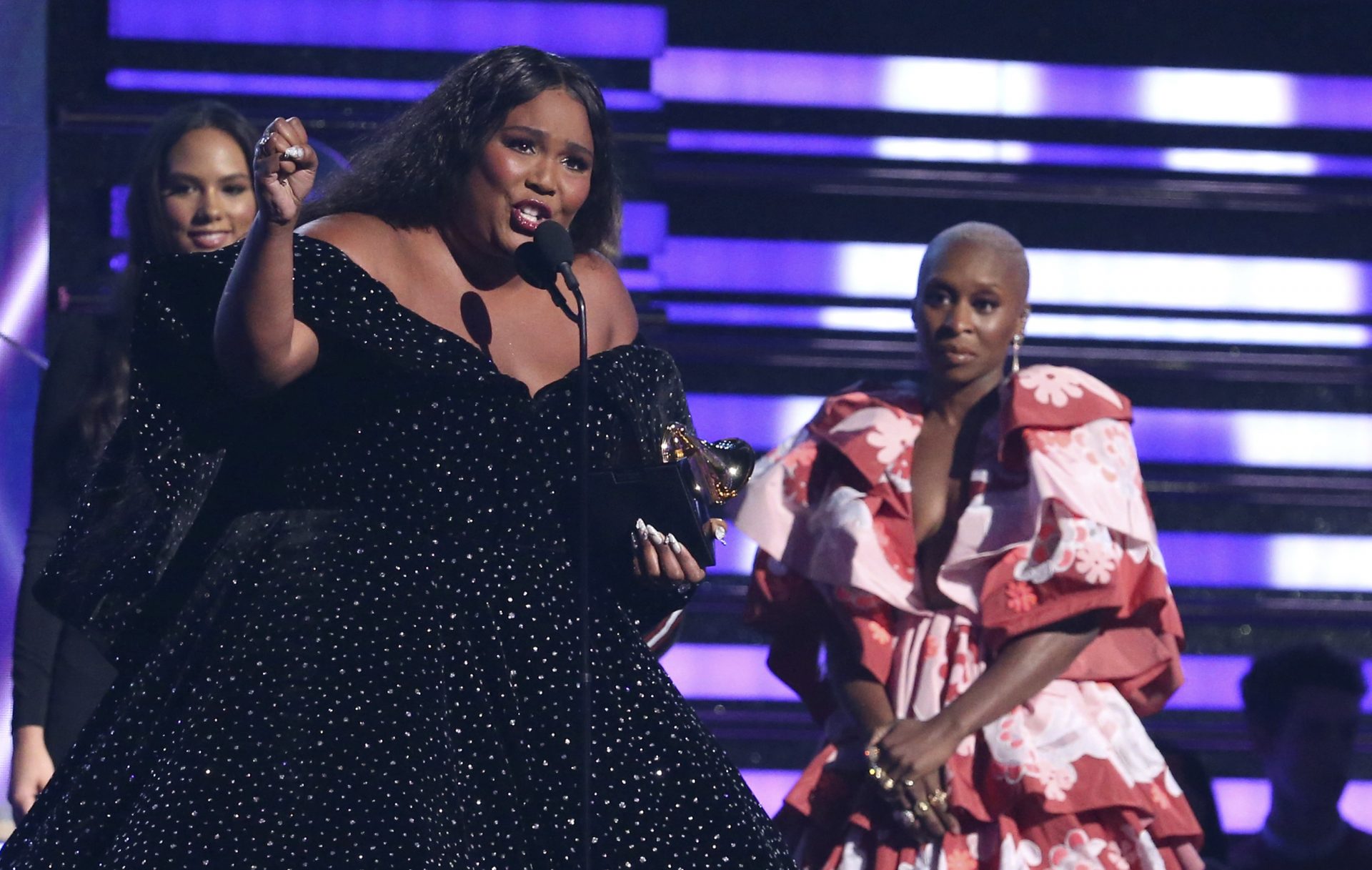 Lizzo accepts the award for best pop solo performance for "Truth Hurts" at the 62nd annual Grammy Awards on Sunday, Jan. 26, 2020, in Los Angeles. Looking on at right is Cynthia Erivo.