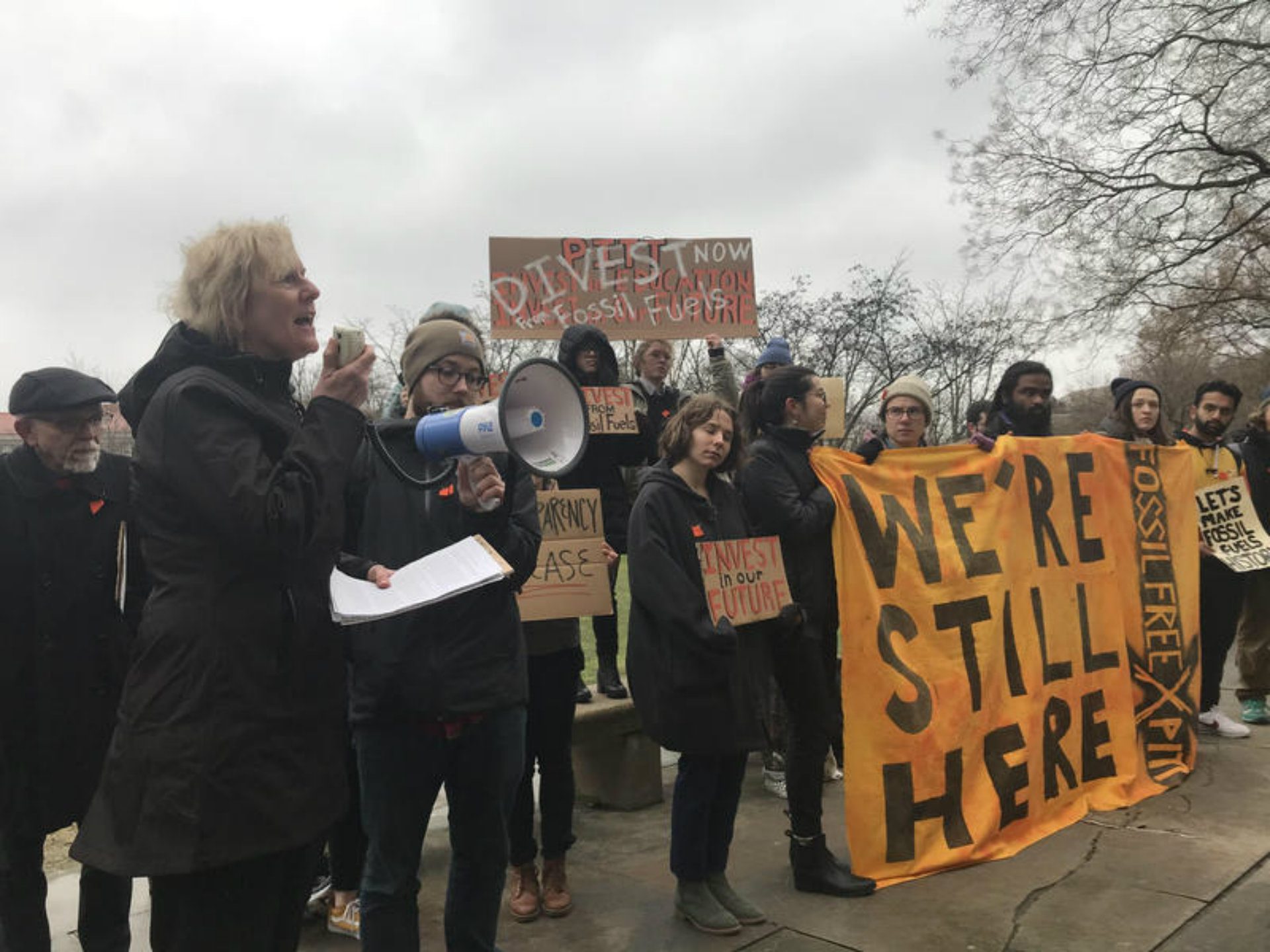 Pitt alum Ellen Dorsey, left, tells a crowd of students Tuesday that she supports their demands for the University of Pittsburgh to divest from fossil fuels.