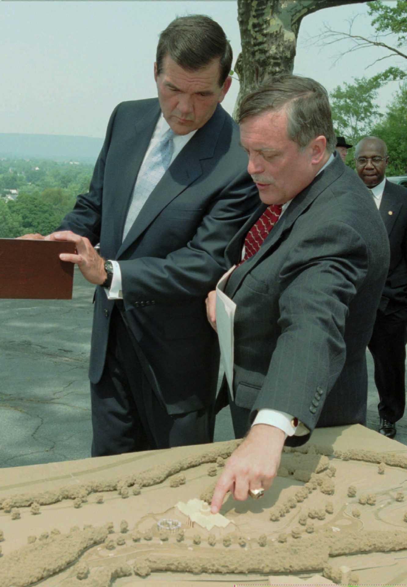 Pennsylvania Gov. Tom Ridge, left , looks on as Harrisburg, Pa. Mayor Stephen Reed shows him a model of the National Civil War Museum during a news conference in Harrisburg, Pa. Wednesday, July 28, 1999. The Museum will be built in Reservior Park in Harrisburg