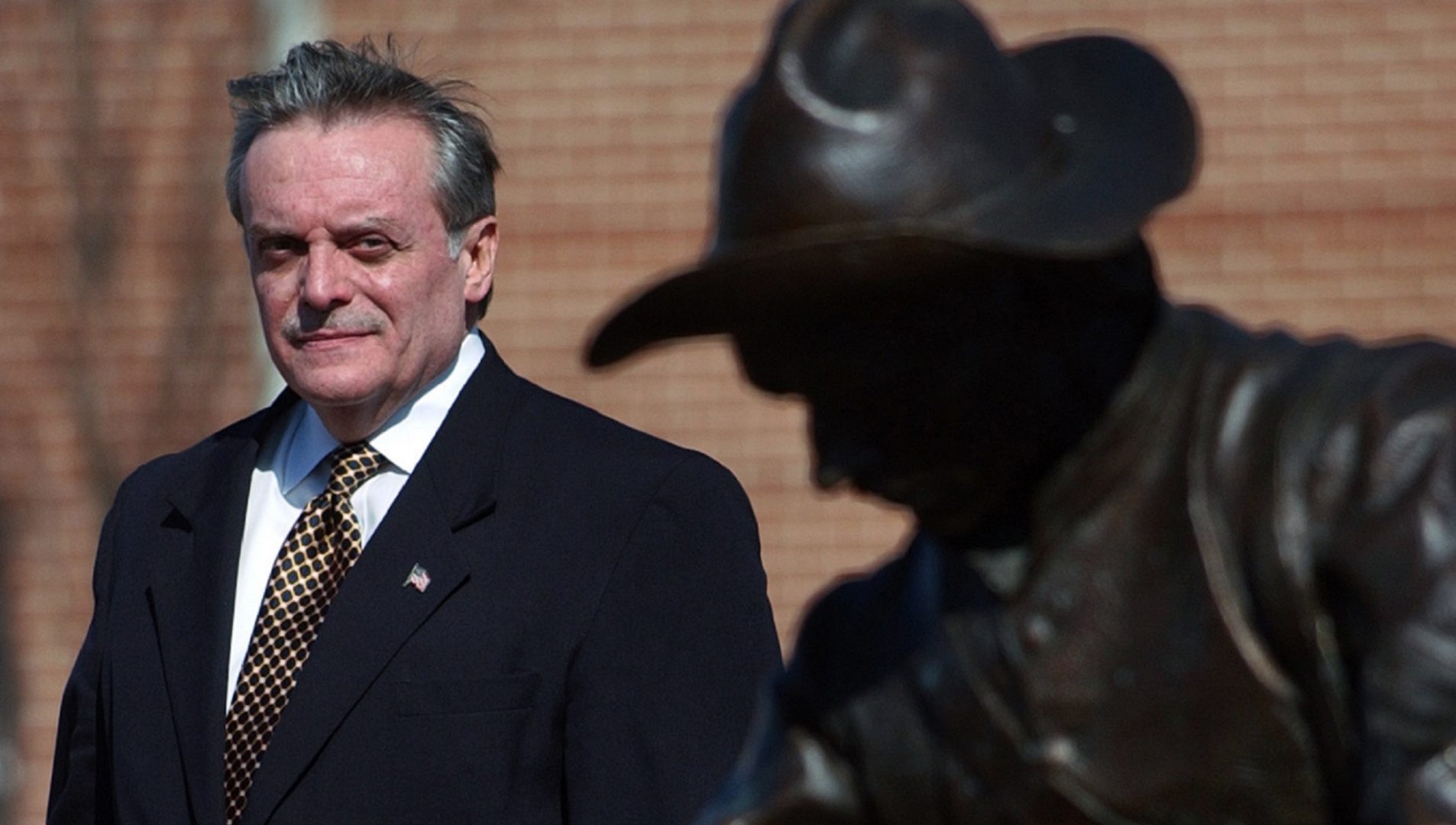 FILE PHOTO: Harrisburg Mayor Stephen Reed stands behind the bronze sculpture 