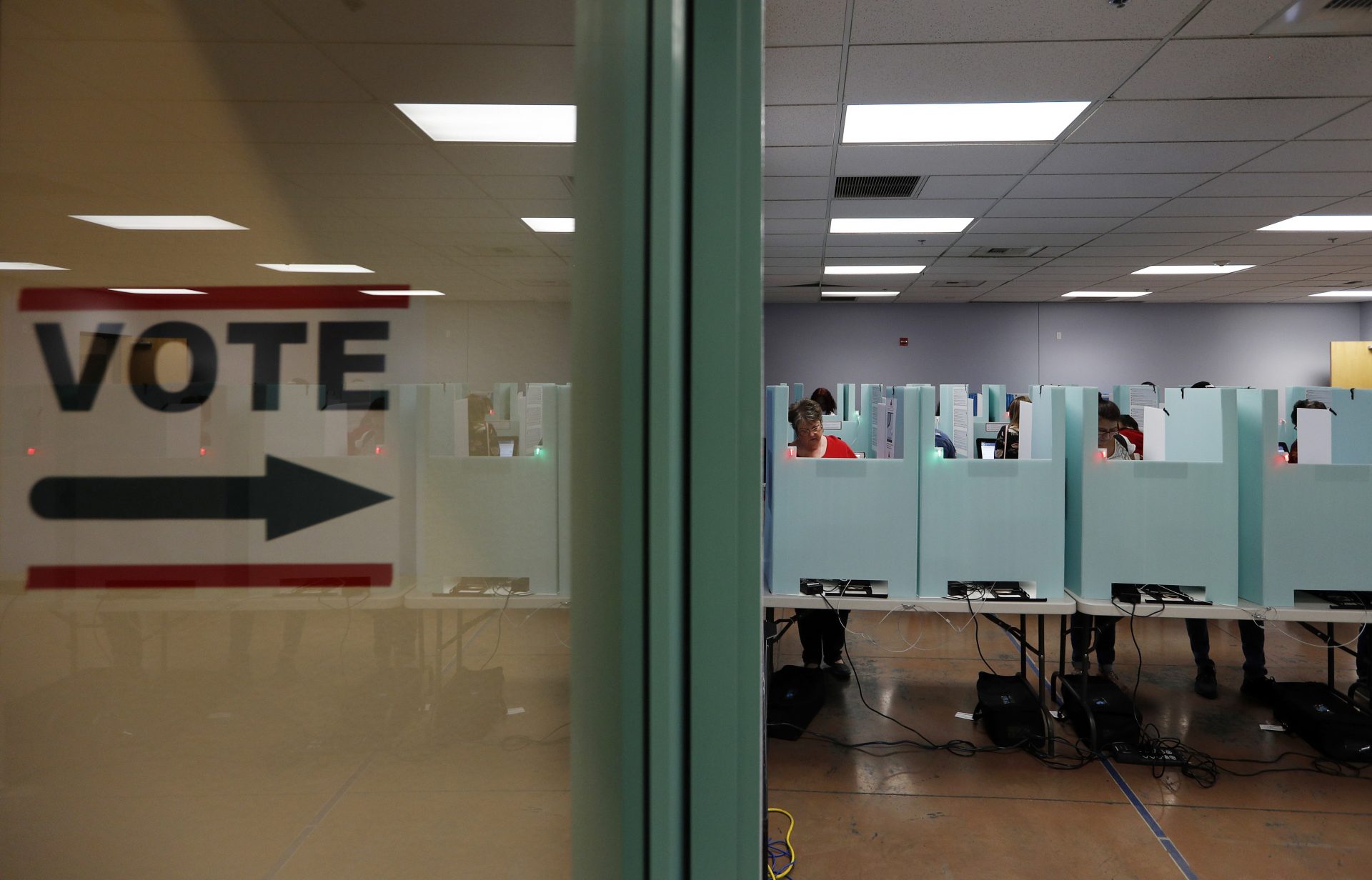 FILE PHOTO: In this Nov. 6, 2018, file photo, people vote at a polling place in Las Vegas. State election officials in at least two dozen states, including Nevada, have seen suspicious cyber activity in the first half of January 2020, although itâ€™s unclear who was behind the efforts and no major problems were reported.