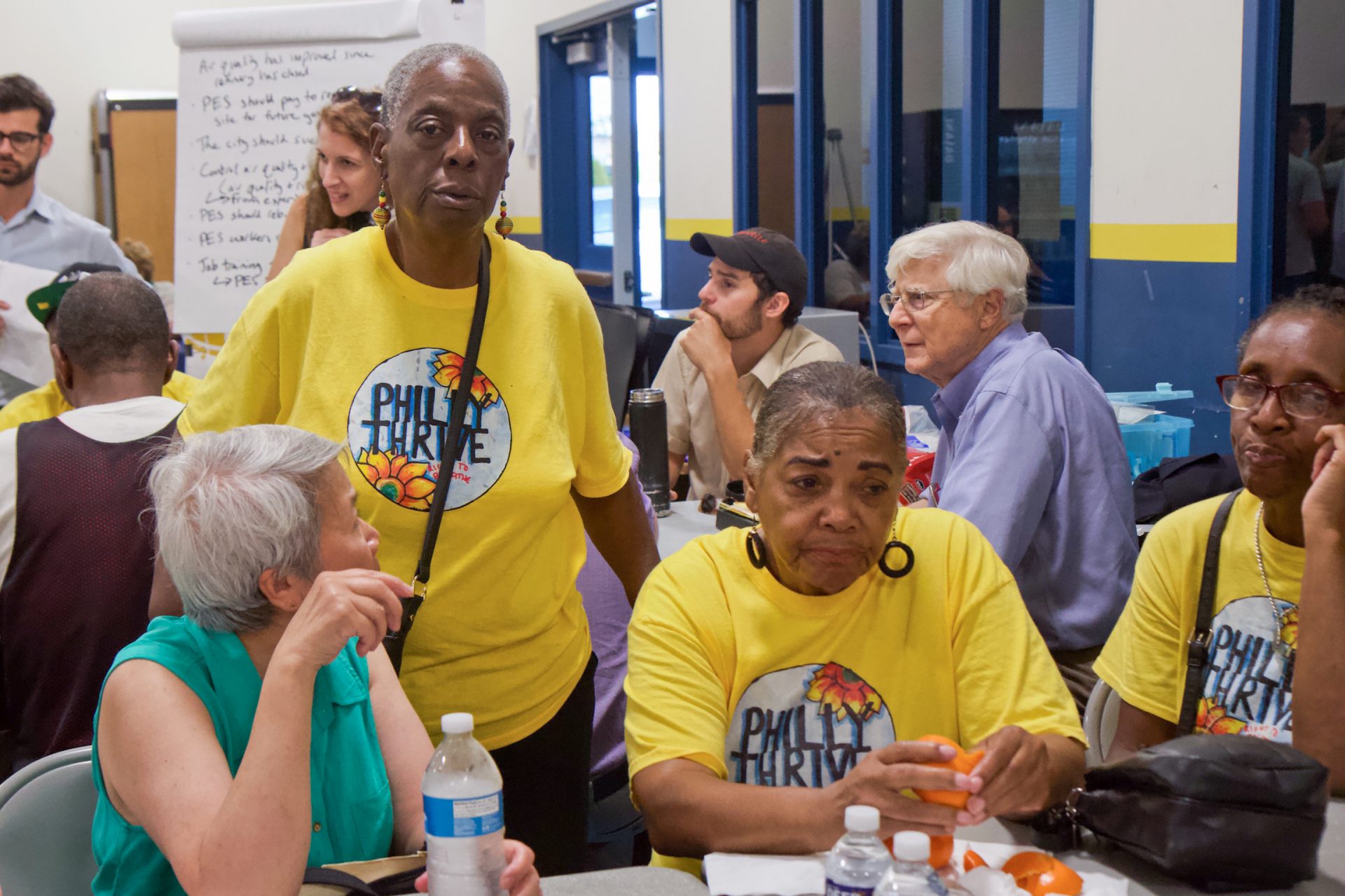 Carol Hemingway (center left) has been an activist in Southwest Philly for 35 years. She said she’s tired after arguing with a steel worker at the city’s community meeting. (Kimberly Paynter/WHYY)