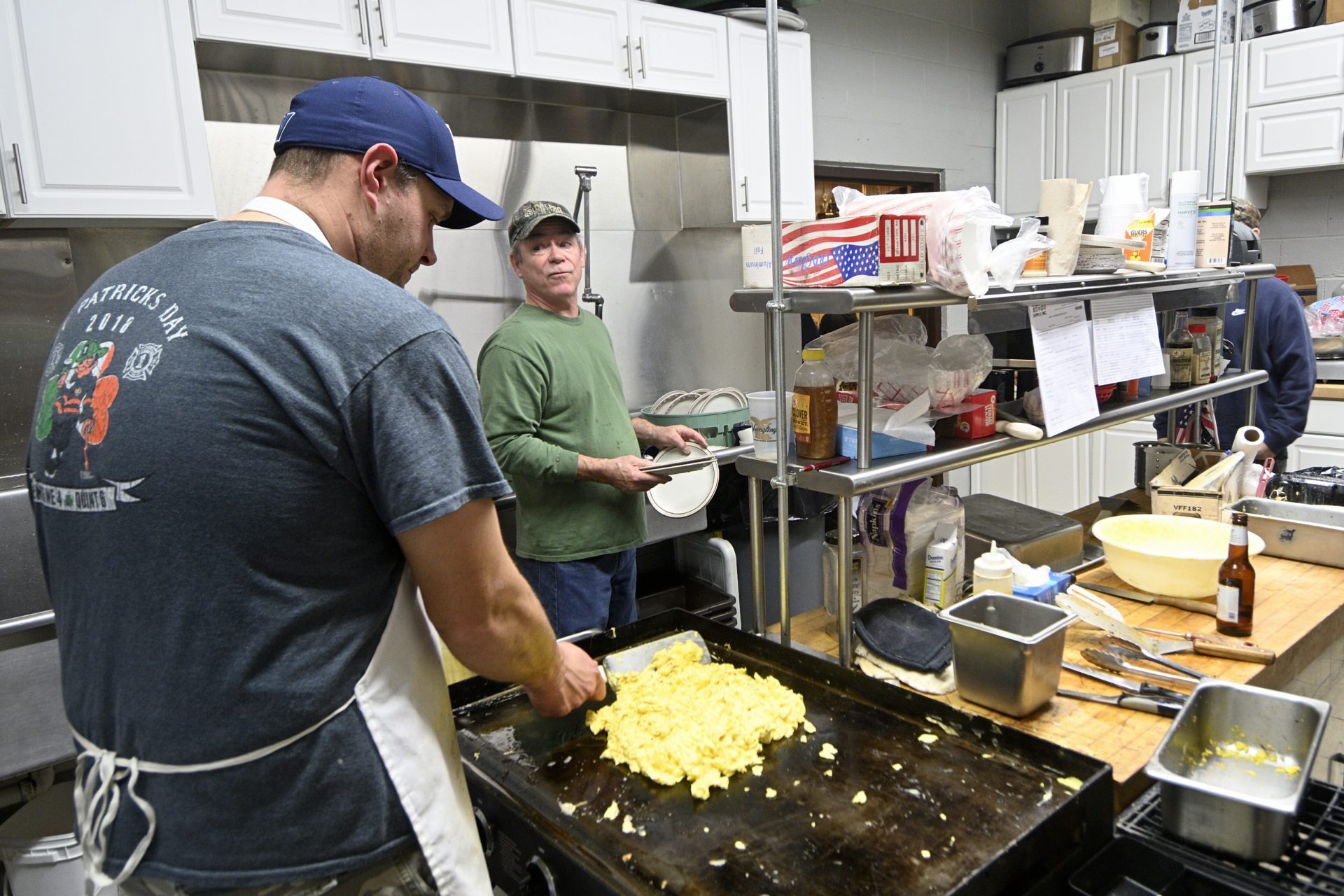 Volunteer firefighters prepare breakfast for the monthly All You Can Eat event at the Social Quarters of Humane Fire Co., in Pottsville, PA, on December 15, 2019.