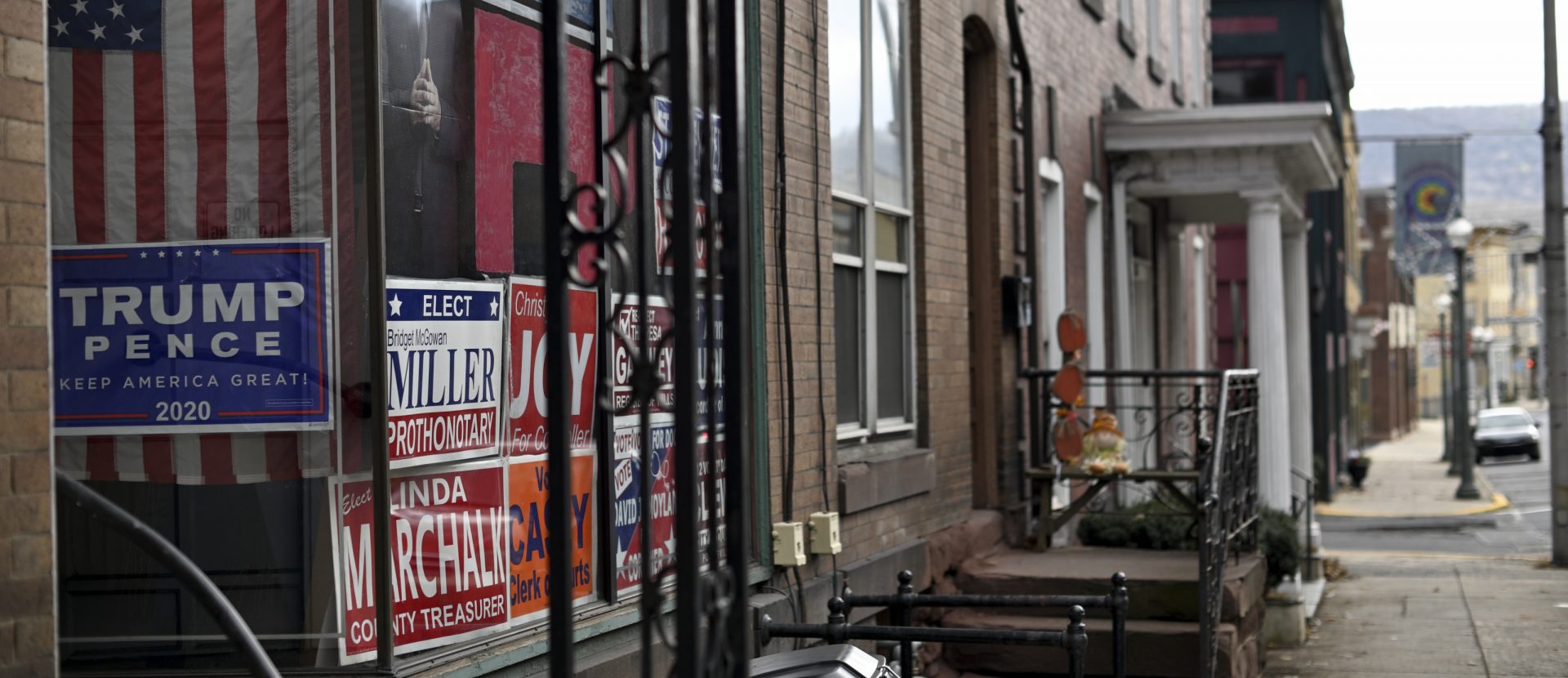 Campaign signs in support of Republican candidates and a cardboard cut-out portrait of President Donald Trump decorate a window along Hotel St. in Pottsville, PA, on December 15, 2019.