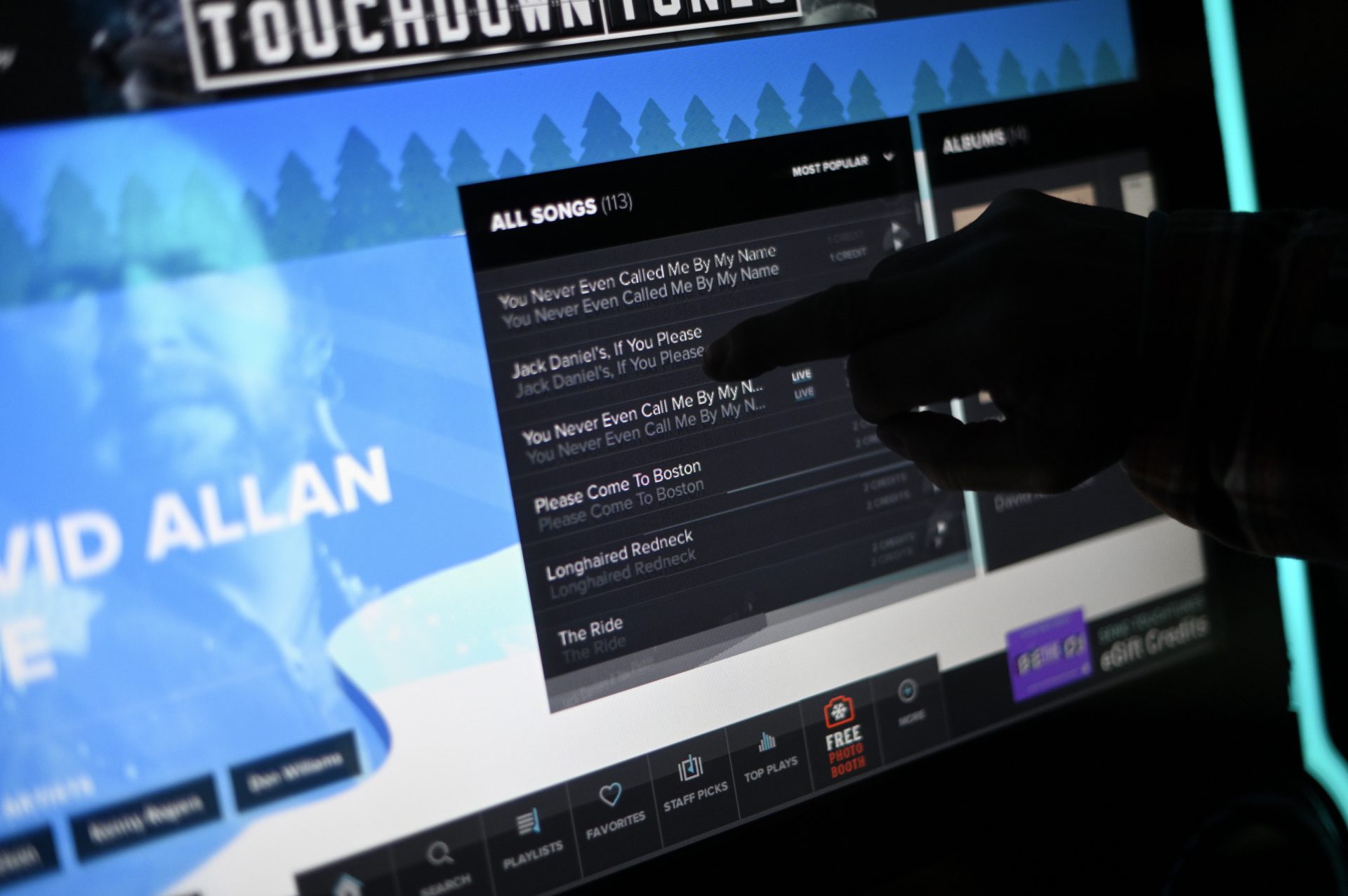 The touchscreen of a jukebox at Deer Lake & West Brunswick Fire Company No. 1. featuring the music of David Allan Coe.