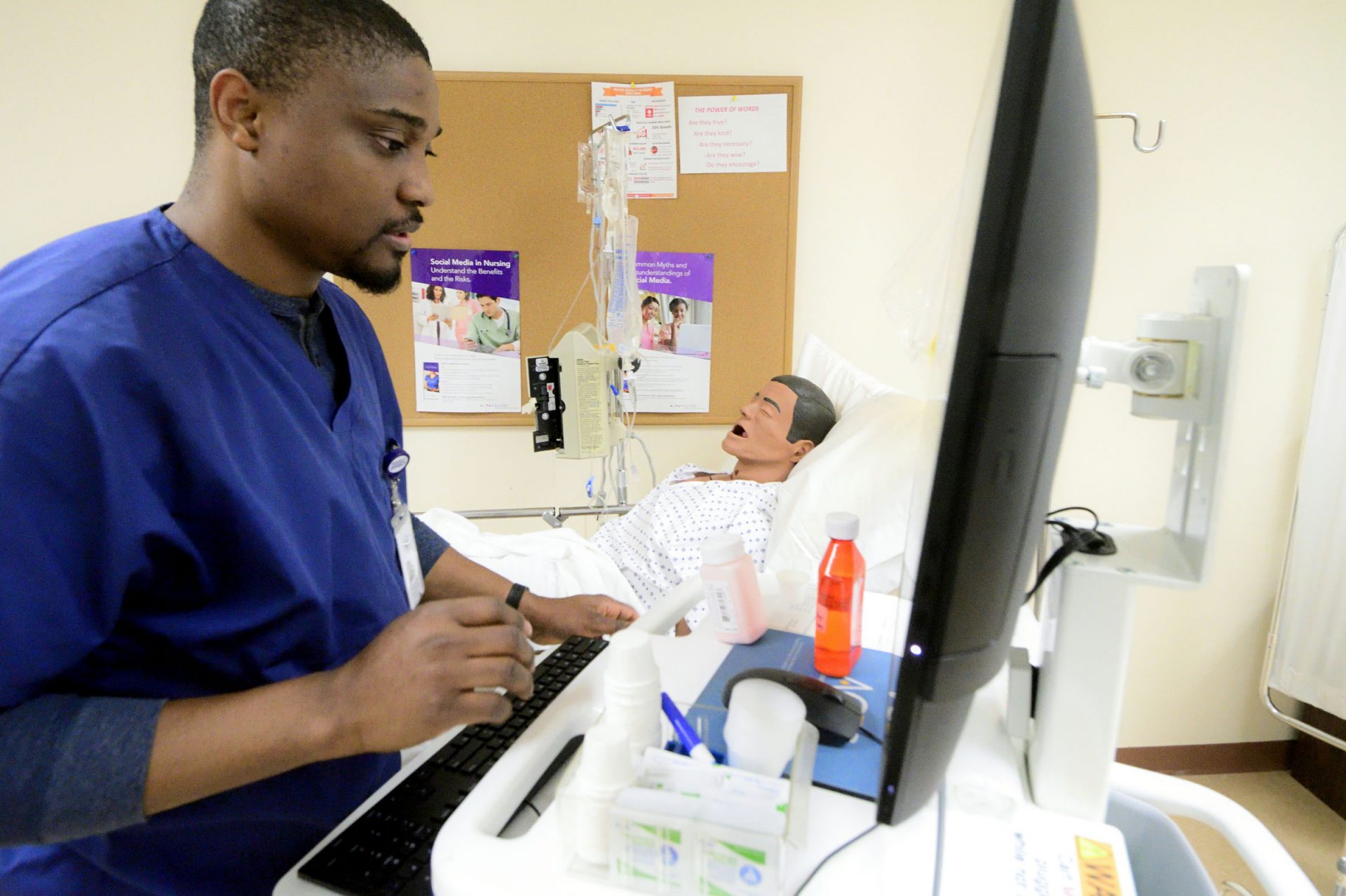 Chukwuka Asakwe attends to a mannequin in a training situation of the Delaware County Technical School Practical Nursing Program, in Broomall, Pa.
