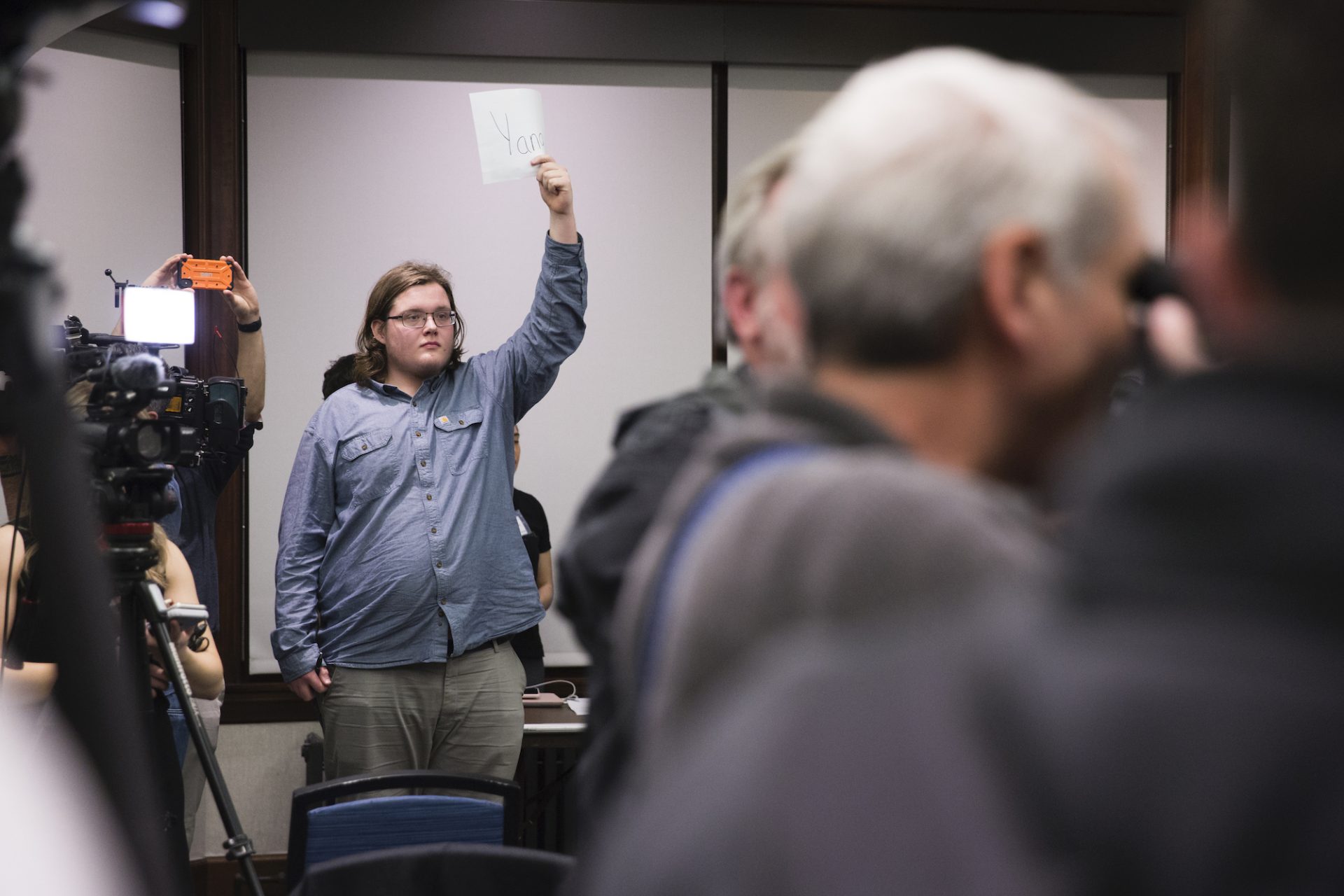 Samuel Pederson, 19, a student at the University of Pennsylvania, petitions for Andrew Yang at Penn's satellite Iowa caucus on February 3, 2020. Pederson ultimately cast his vote for Bernie Sanders after Yang could not achieve viability.