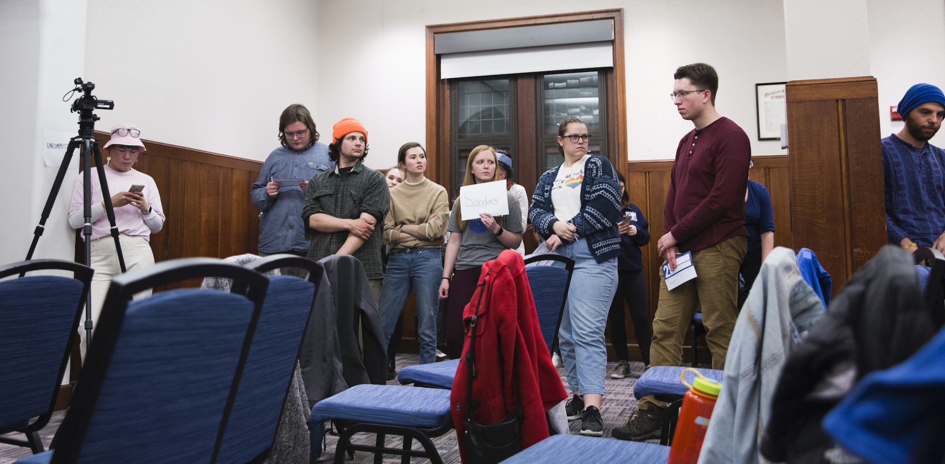 Samuel Pederson (left in center group) stands with the four caucus participants voting for Bernie Sanders at the Univerity of Pennsylvania sattelite Iowa caucus on February 3, 2020. Pederson originally intended to vote for Andrew Yang, but was swayed to vote Sanders. Sanders was awarded two of the four delegate votes from the group, with the remaining two going to Warren and Buttigieg.