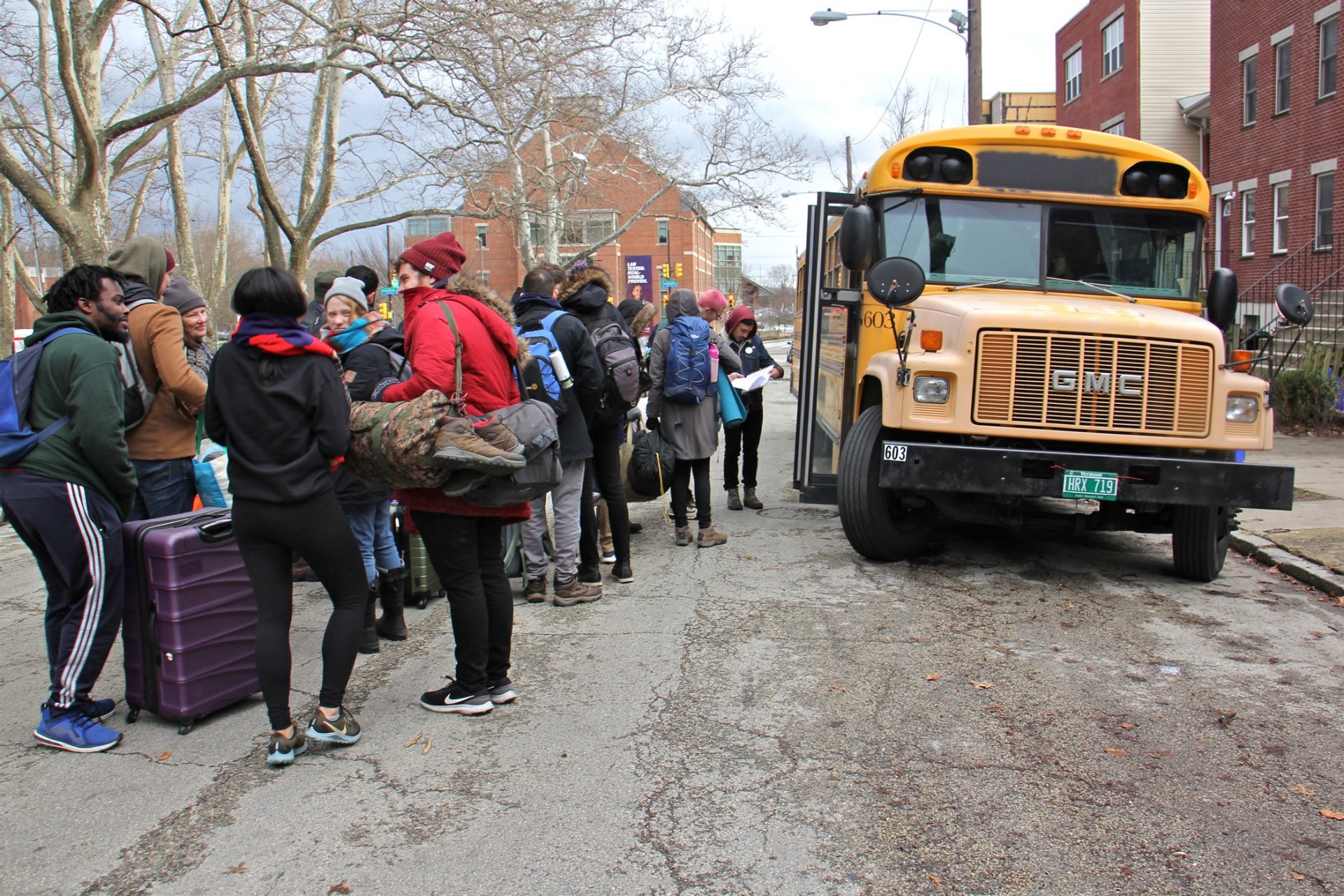 Students from Penn, Drexel and other area universities board an old school bus headed for New Hampshire. About 30 in all, they will canvas for presidential candidate Bernie Sanders.