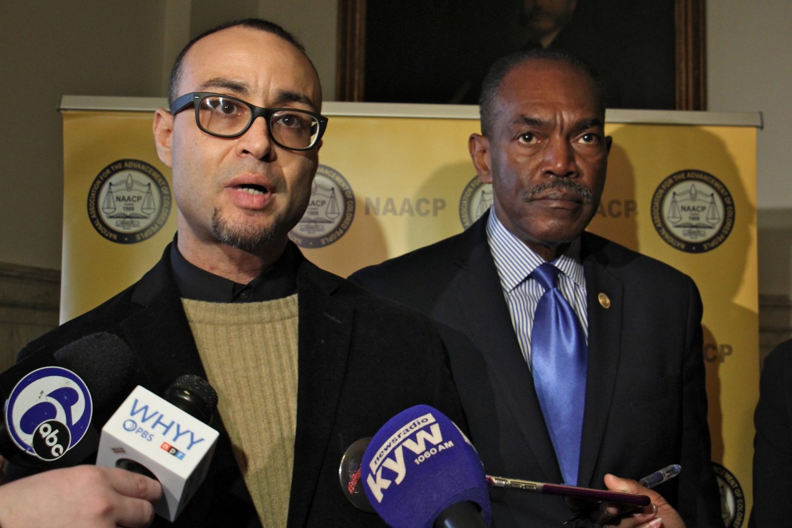 The NAACP has announced that it has filed suit on behalf of Robert Holbrook (left) and other currently and formerly incarcerated people whose Census numbers apply to the community where they are incarcerated rather than where they live. Holbrook spoke during a press conference at City Hall, accompanied by Philadelphia NAACP President Rodney Muhammad (right).