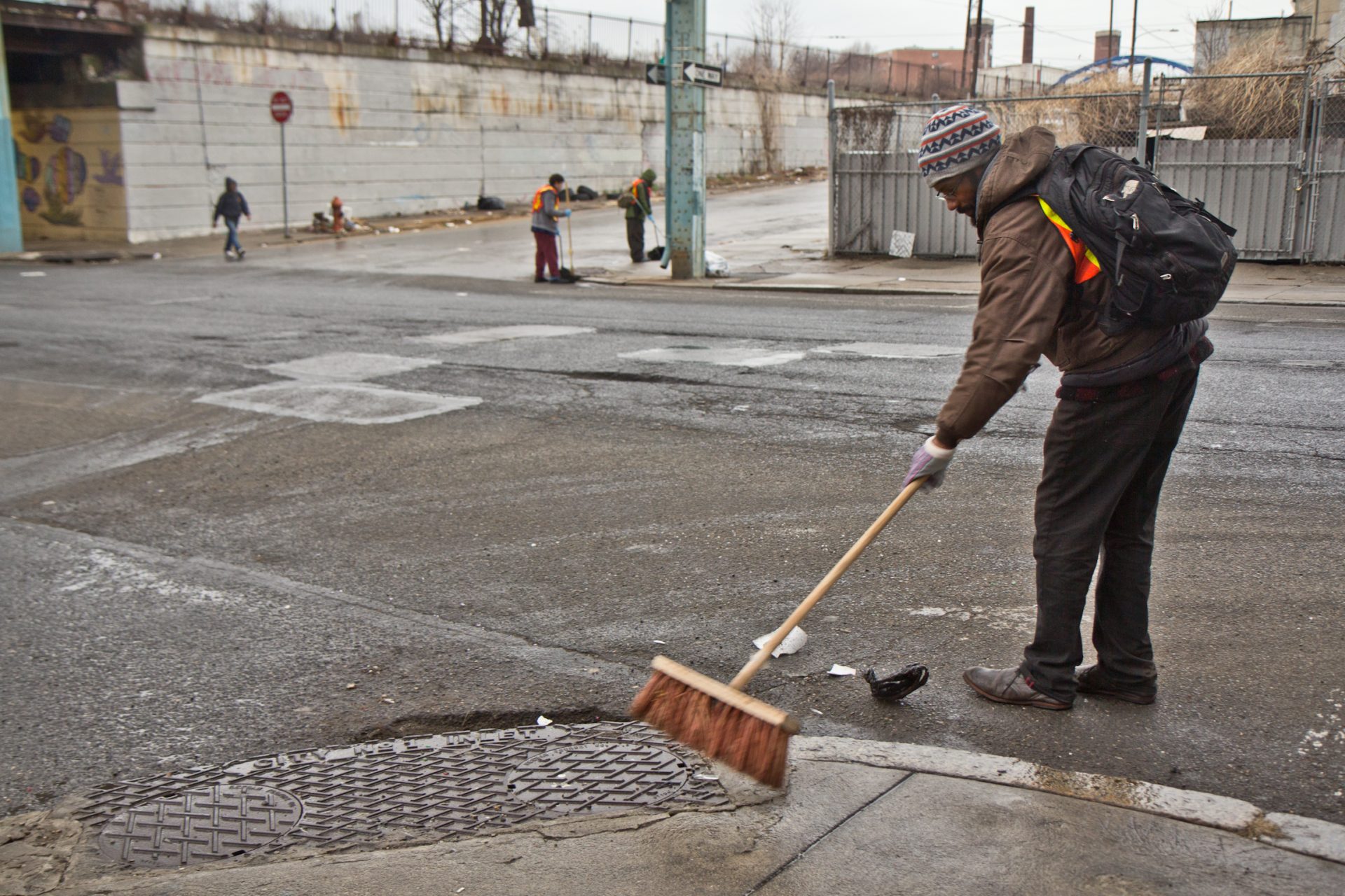 Brandon Johnson sweeps Kensington Ave. as part of the Work-to-Earn program in Philadelphia.