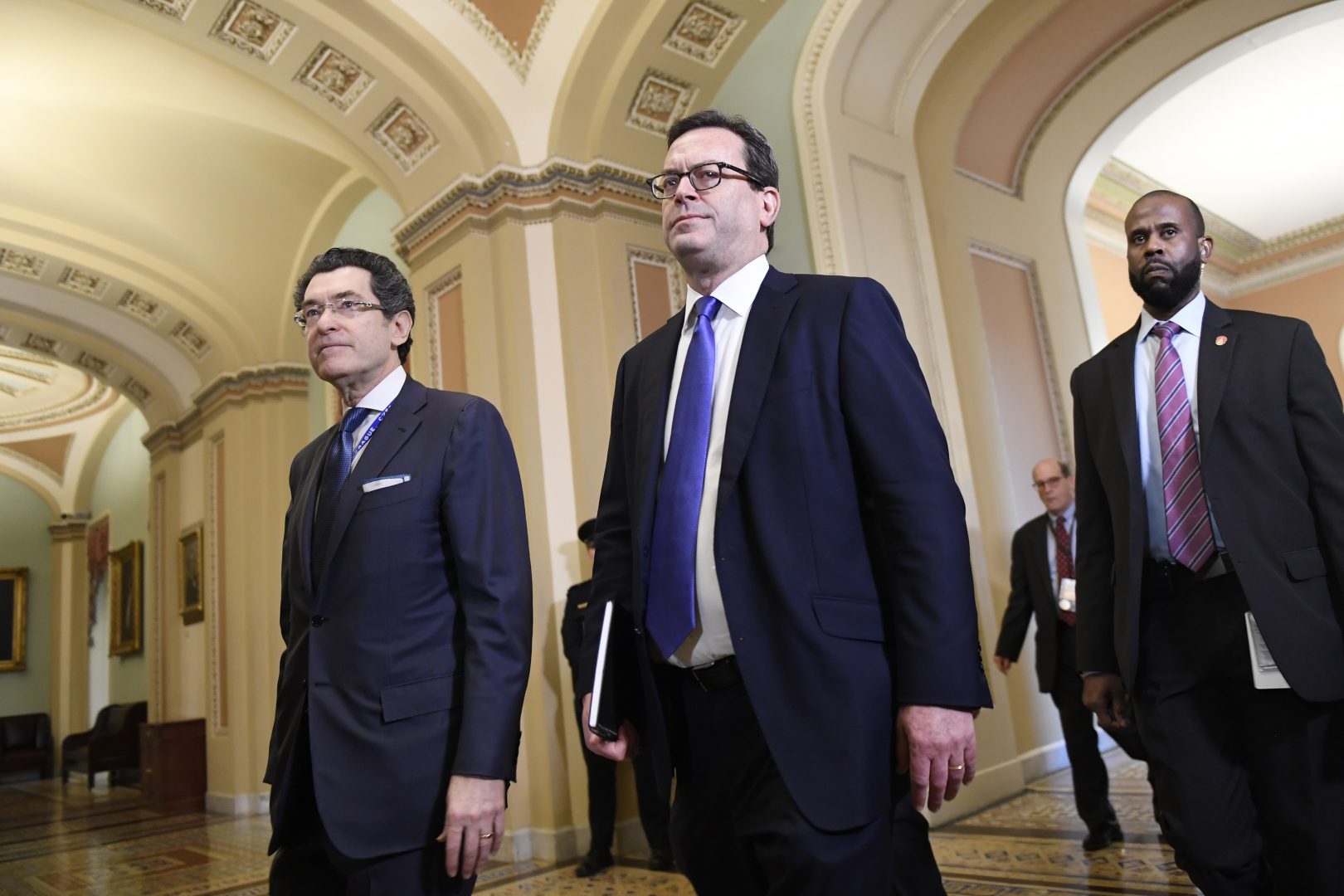 House Democrat attorneys Norm Eisen, left, and Barry Berke, center, arrive on the Senate side of Capitol Hill in Washington, Monday, Feb. 3, 2020, for the impeachment trial of President Donald Trump.