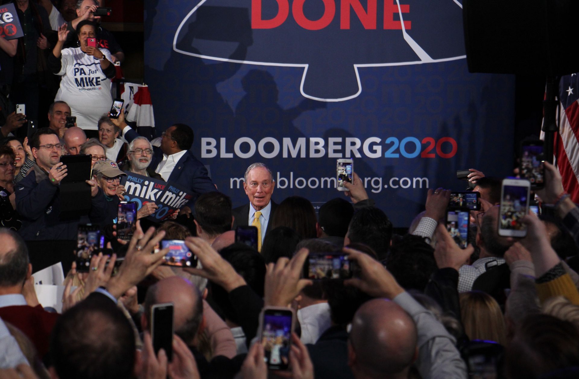 Democratic presidential candidate Michael Bloomberg arrives to a cheering crowd at the National Constitution Center in Philadelphia.