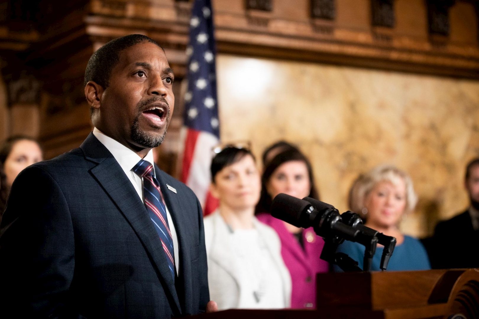 Micah Sims, executive director of Common Cause Pennsylvania, speaks at the Capitol during the signing of an election reform bill on Oct. 31, 2019. The group, which helped champion the state's 2006 lobbying law, was fined $19,900 for breaking it. Sims attributed the failure to technical difficulties. (