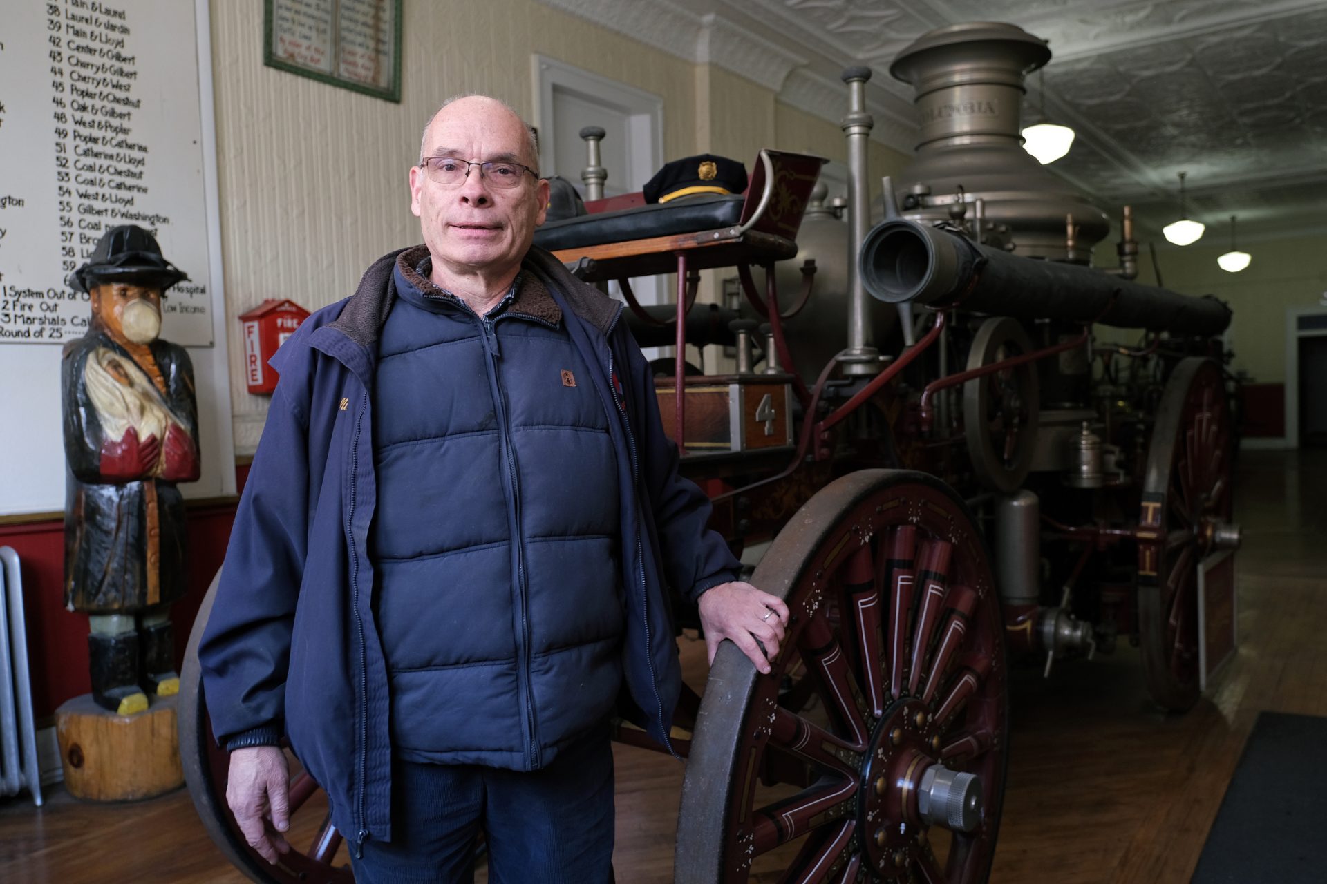 Veteran firefighter Mike Kitsock stands by a 1909 Ahrens Continental steam fire engine is displayed Jan. 16, 2020, at the Schuylkill Historical Fire Society in Shenandoah, Pennsylvania.