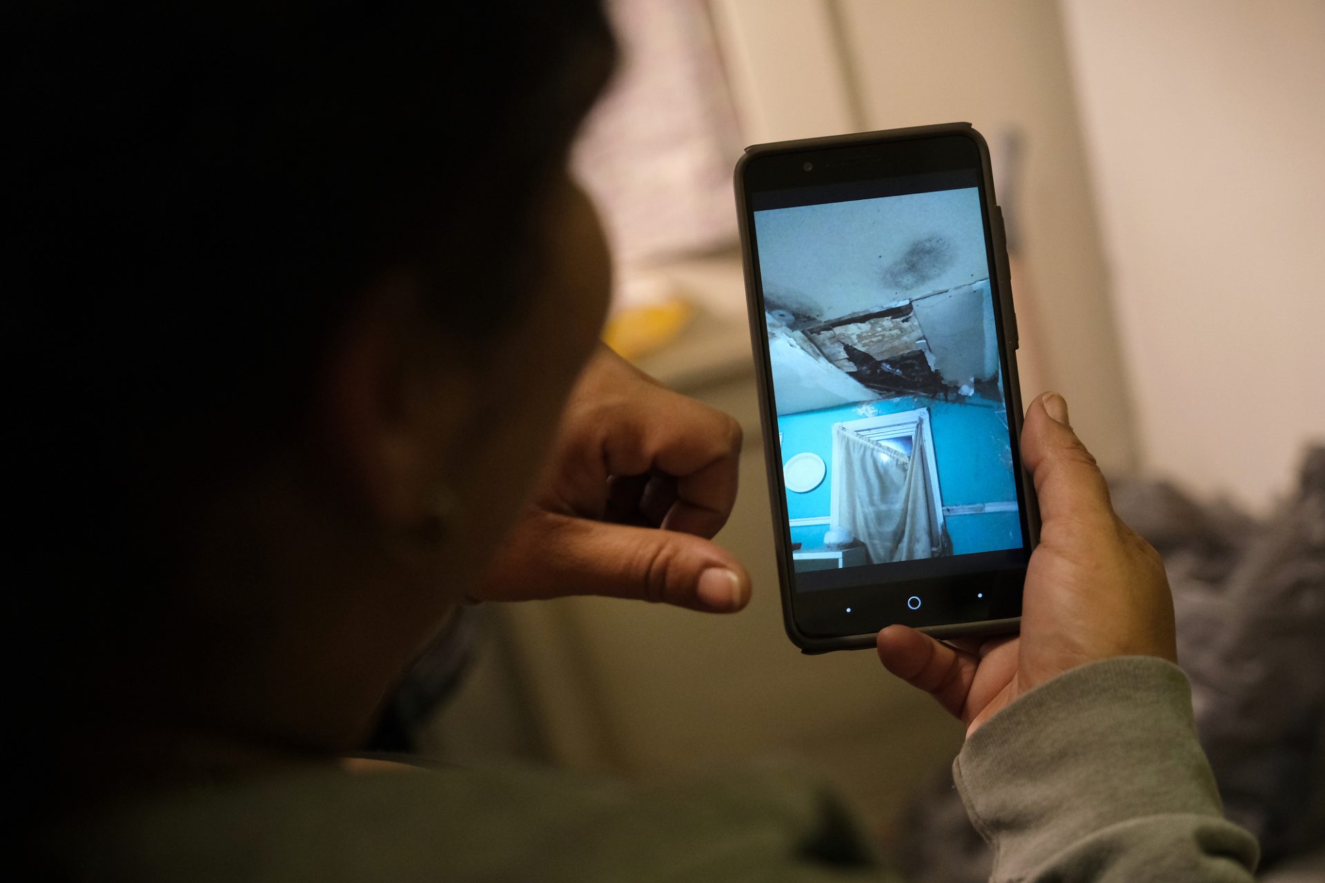 Reading resident Cinthya Delarosa shows the poor conditions of a former property she rented in Reading, Pennsylvania.