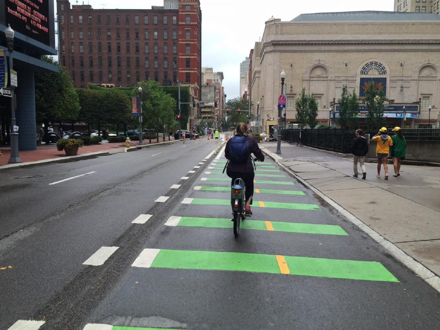 A bicyclist rides in a dedicated bike lane in downtown Pittsburgh.