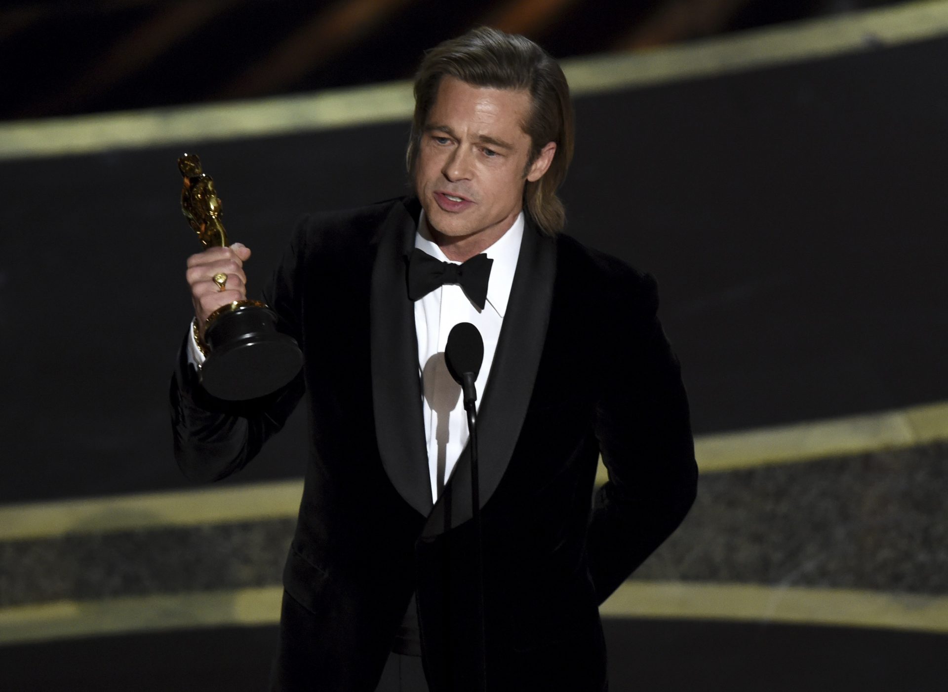 Brad Pitt accepts the award for best performance by an actor in a supporting role for "Once Upon a Time in Hollywood" at the Oscars on Sunday, Feb. 9, 2020, at the Dolby Theatre in Los Angeles.